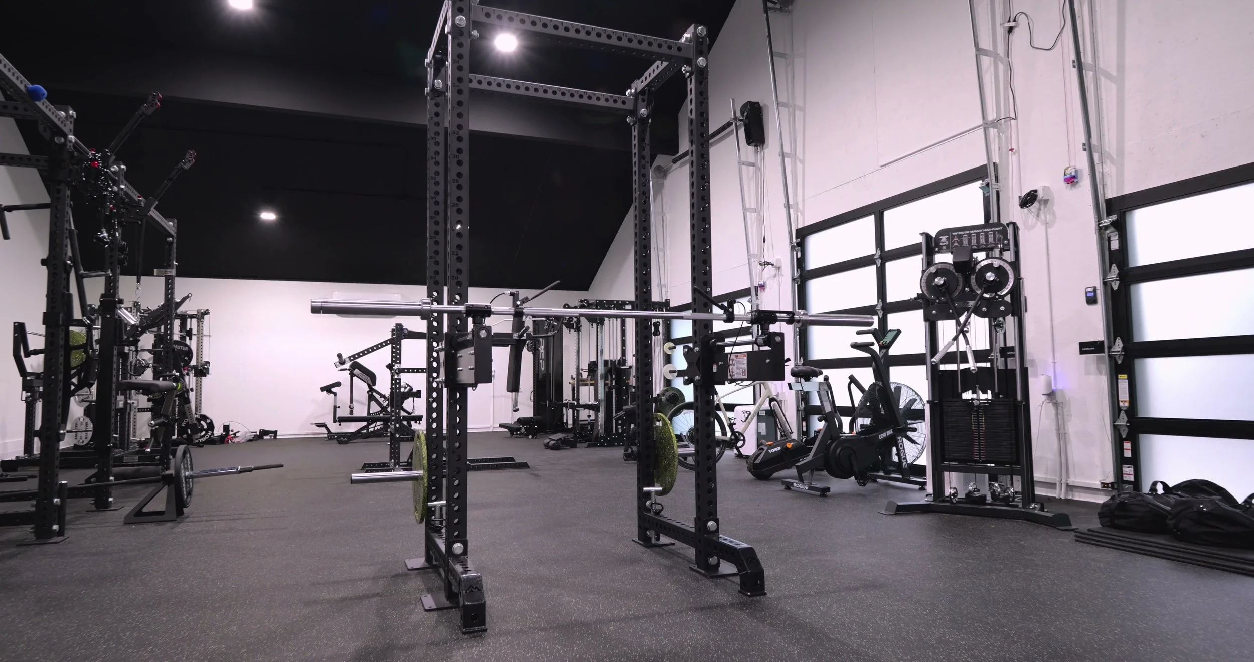 XPT Self-Spotting Bar mounted on a power rack
