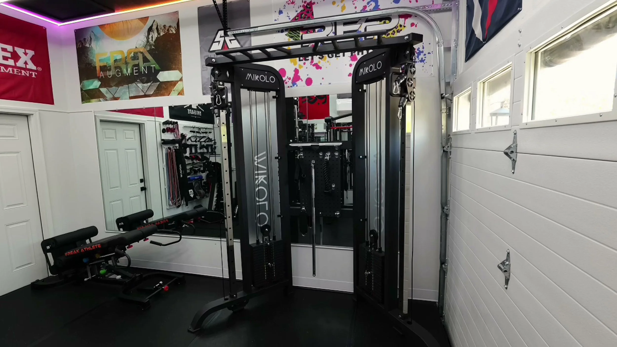 mikolo falcon functional trainer showing dual stacks and wide cable uprights
