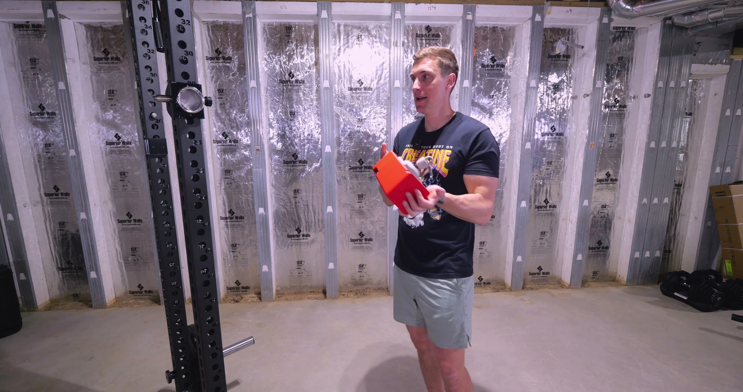 The Beyond Power Voltra mounted to the front foot of a power rack using a quick-release bracket