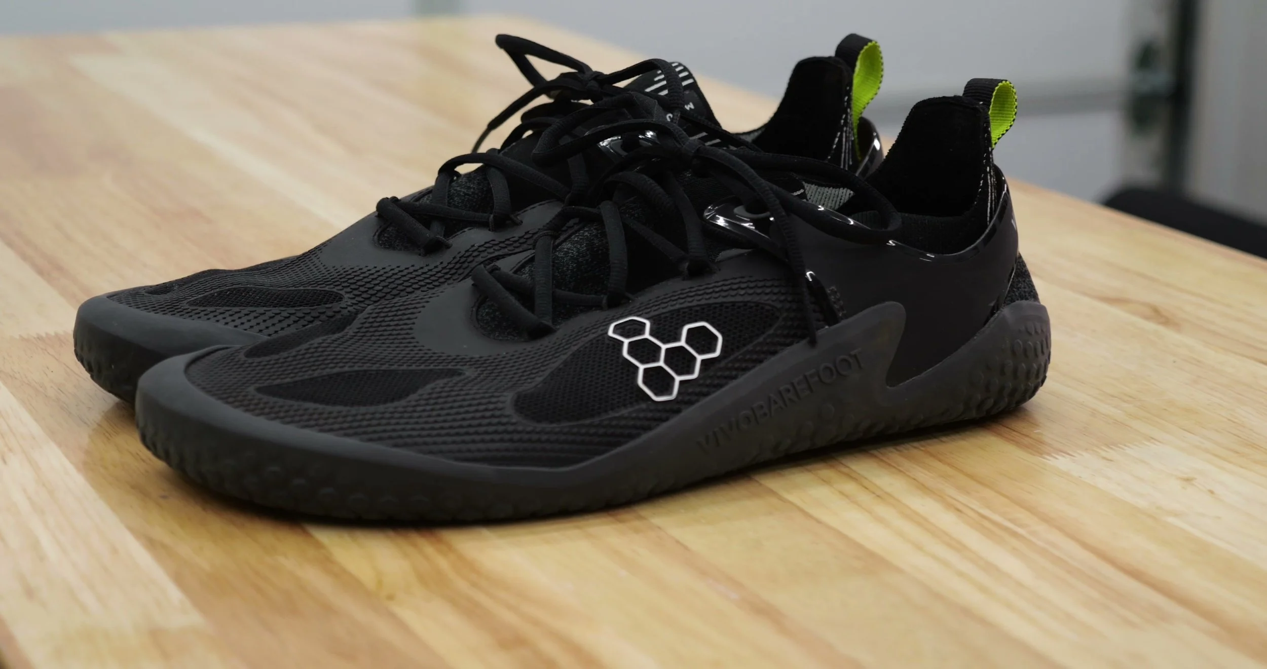 vivobarefoot motus strength minimalist training shoe side profile on gym floor