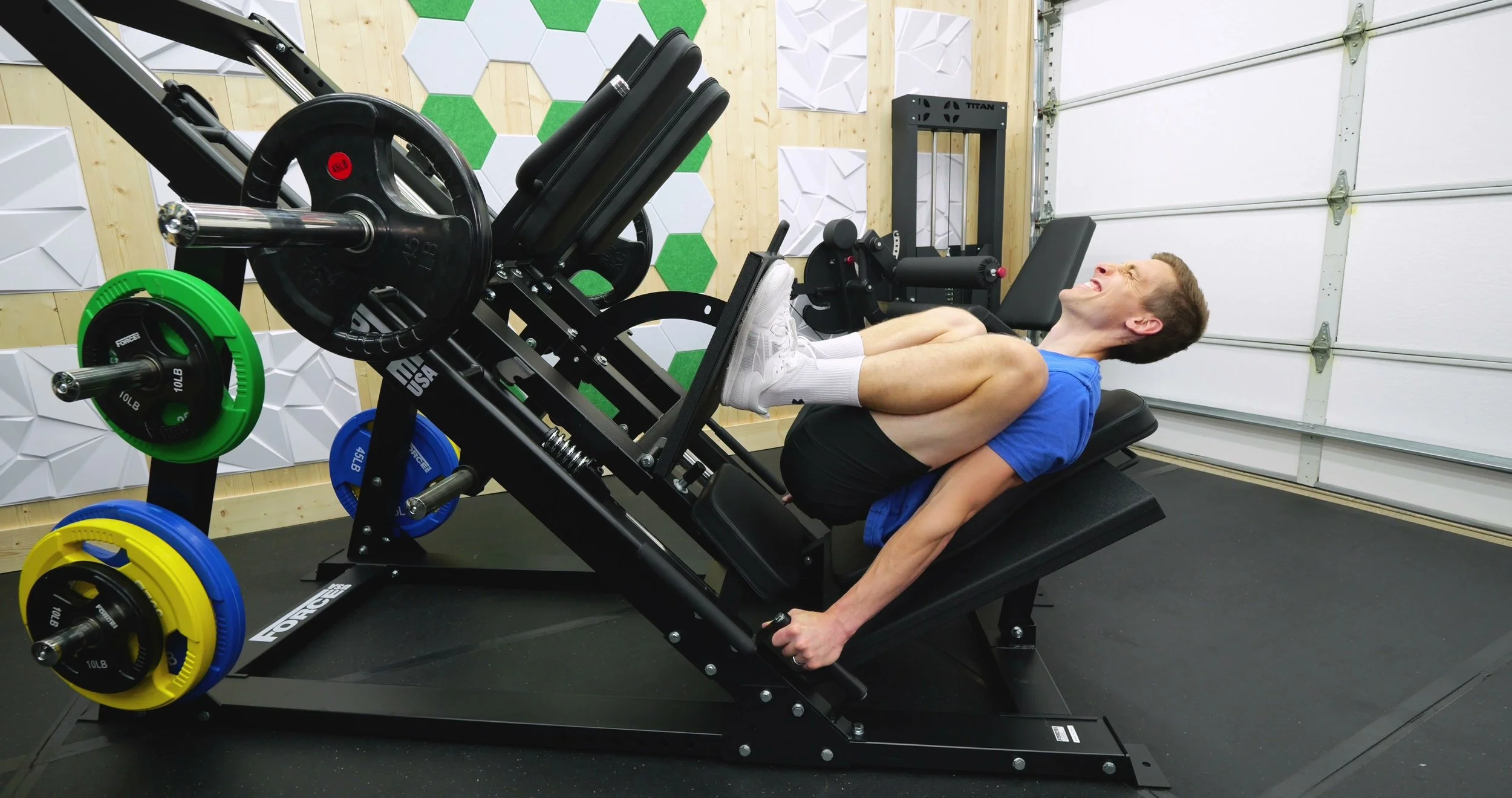 Force USA leg press showing deep range of motion at bottom