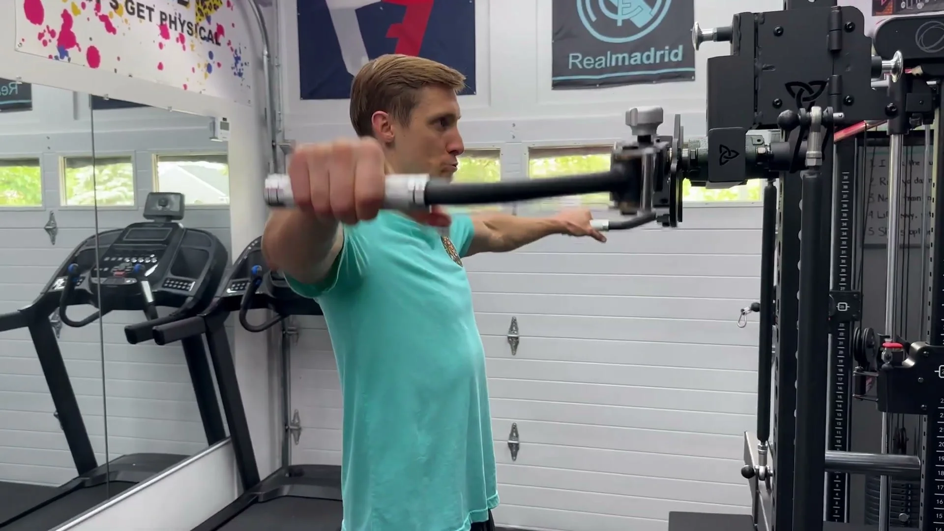 bolt gemini attachment in chest fly configuration with user leaning forward for pec stretch position