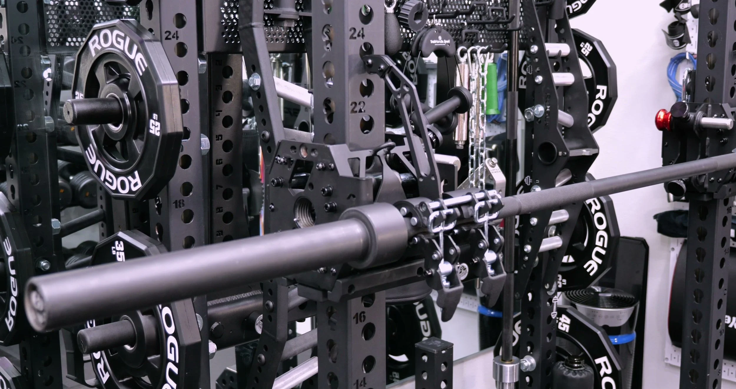 Barbell clamped into both VTS trolleys with latches aligned to rack holes