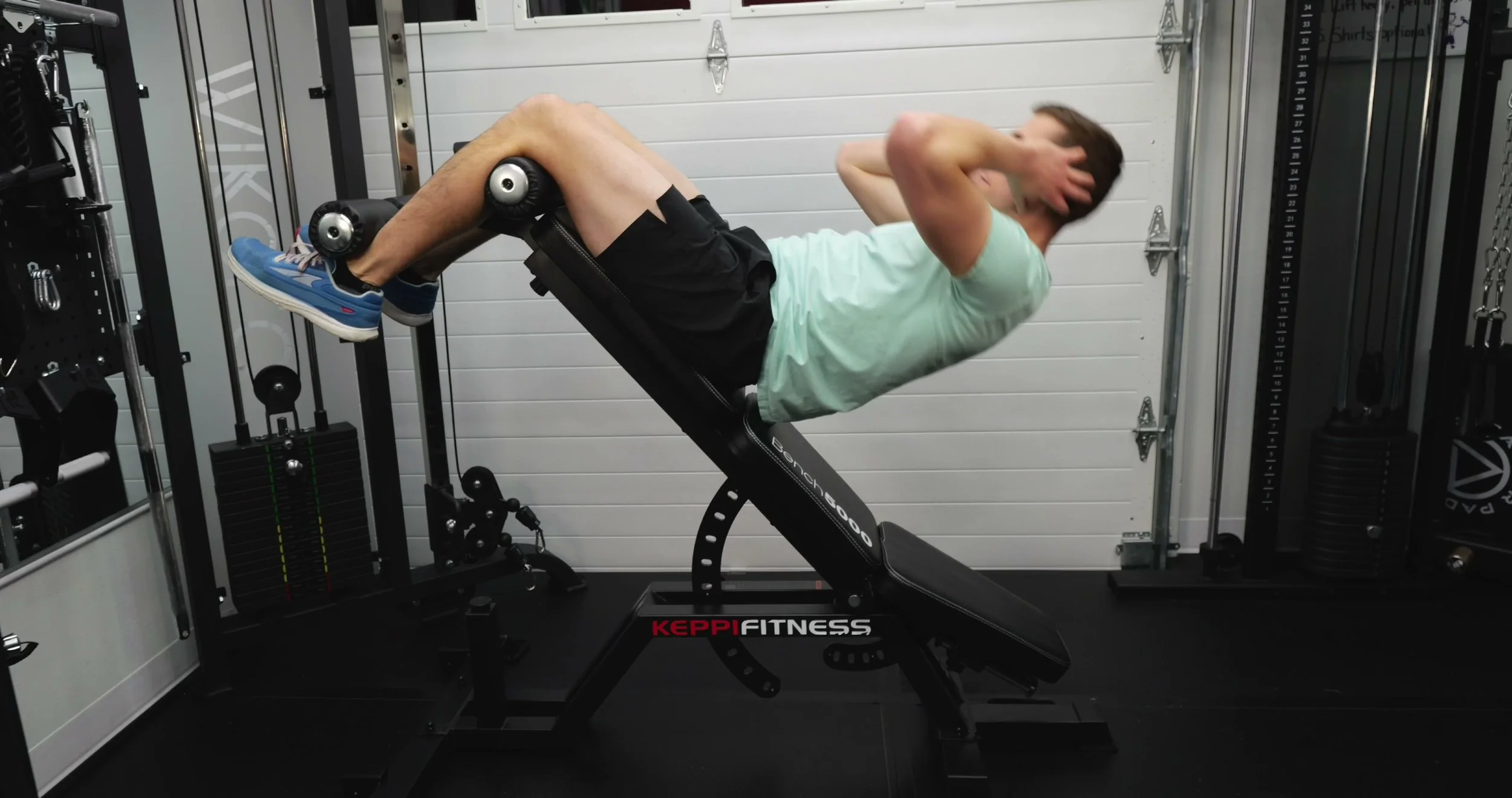 keppi bench in decline mode with adjustable leg roller installed