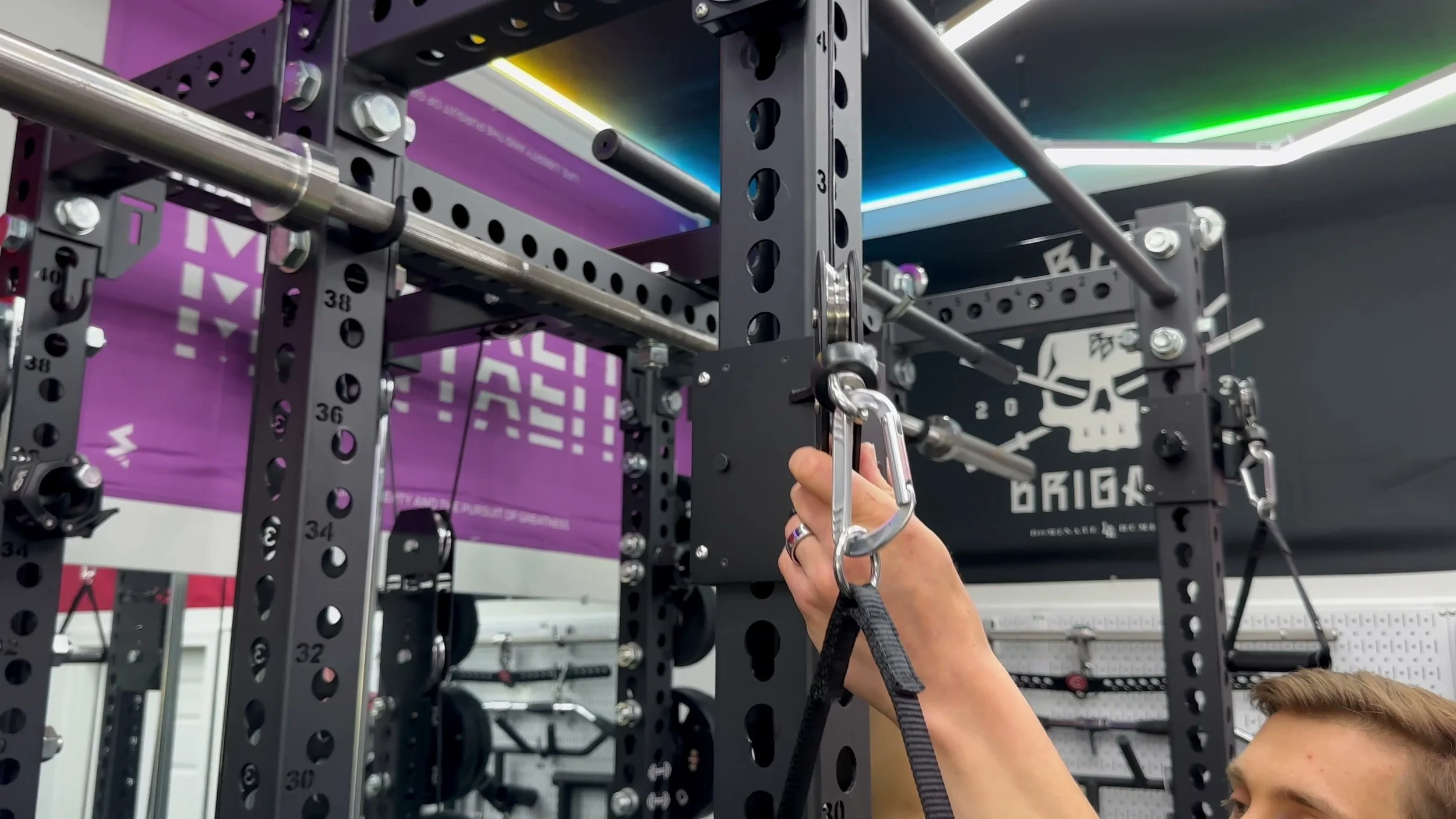 ibex carriage set mid rack height showing handle position for fly or row on functional trainer movement