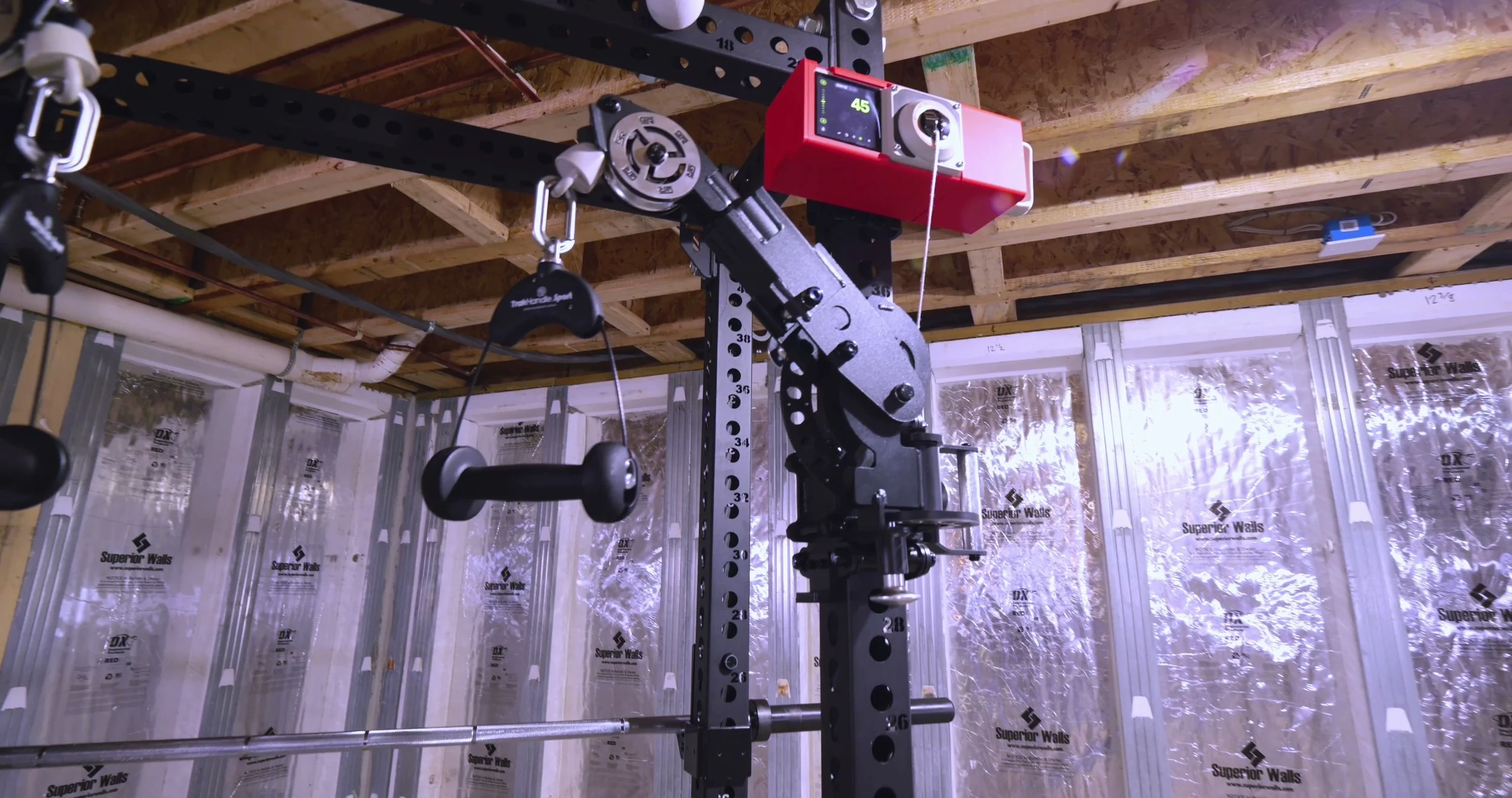 The Beyond Power Voltra mounted to the top crossmember, feeding its cable into the Tornado Arm