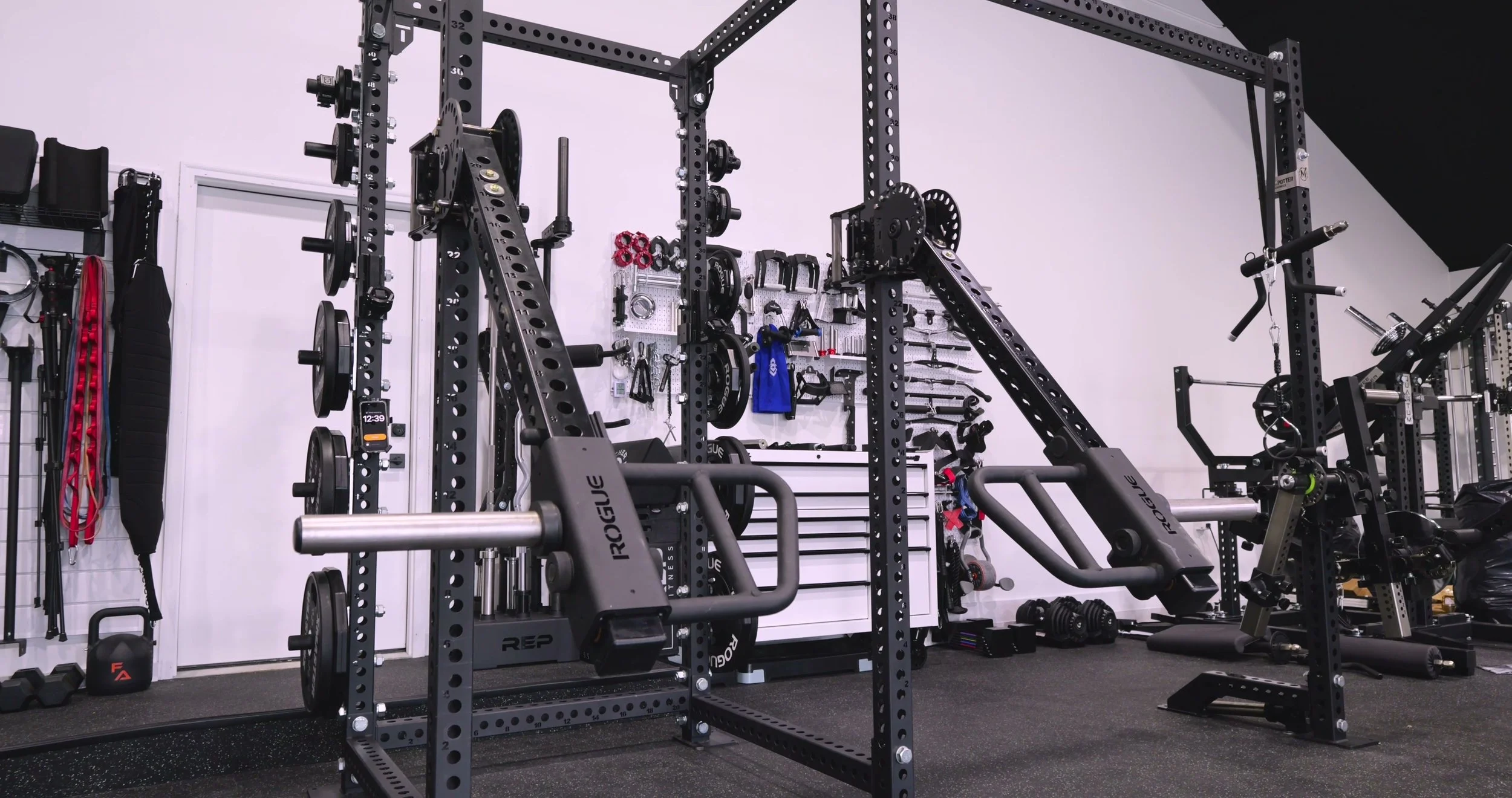 The Rogue Monster LT-1 50 Cal Trolley and Lever Arm Kit attached to a power rack