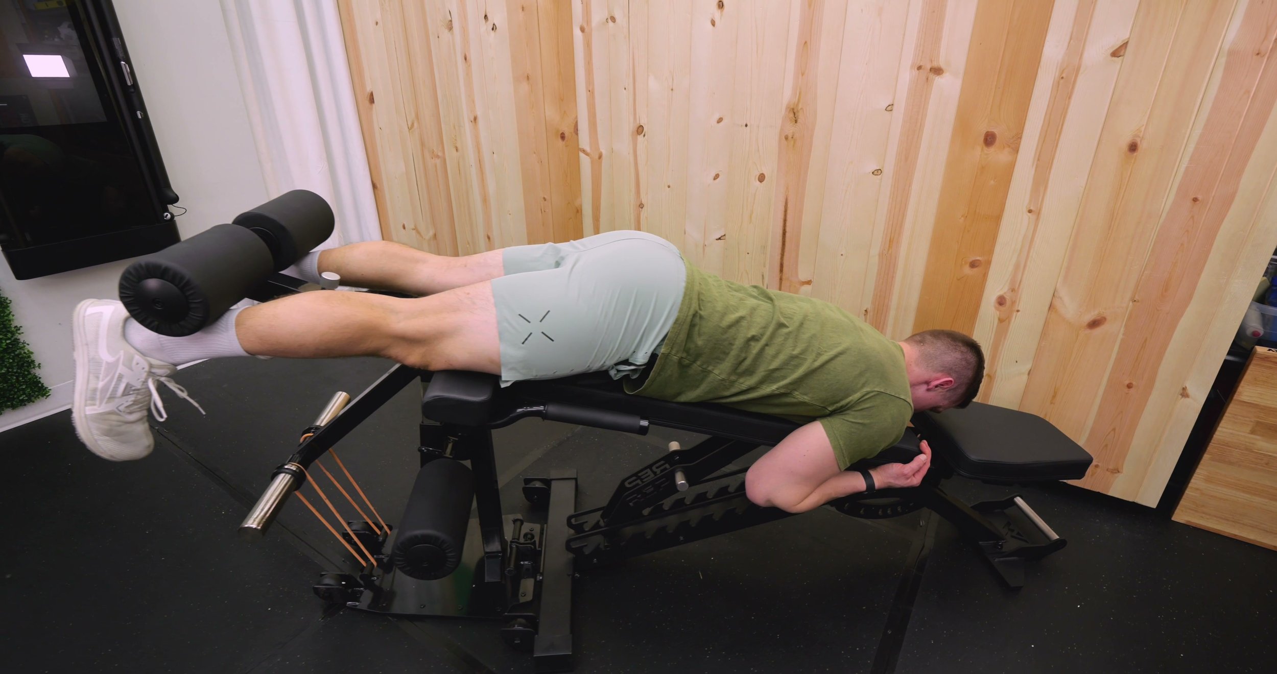 rep bench attachment used for lying leg curls with resistance bands