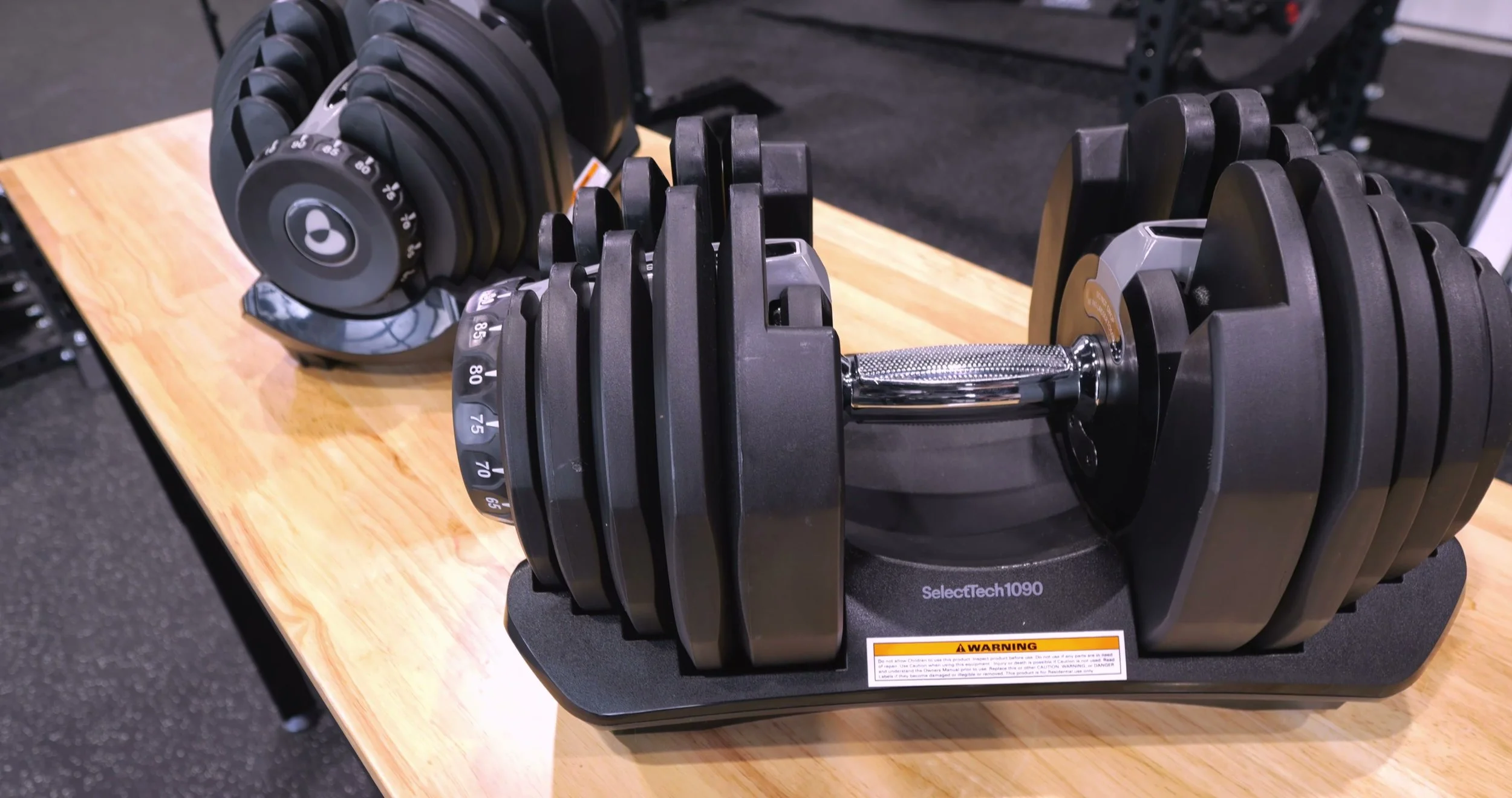 Detail shot of the ergonomic handle on the Bowflex 1090 showing the raised rubber dots