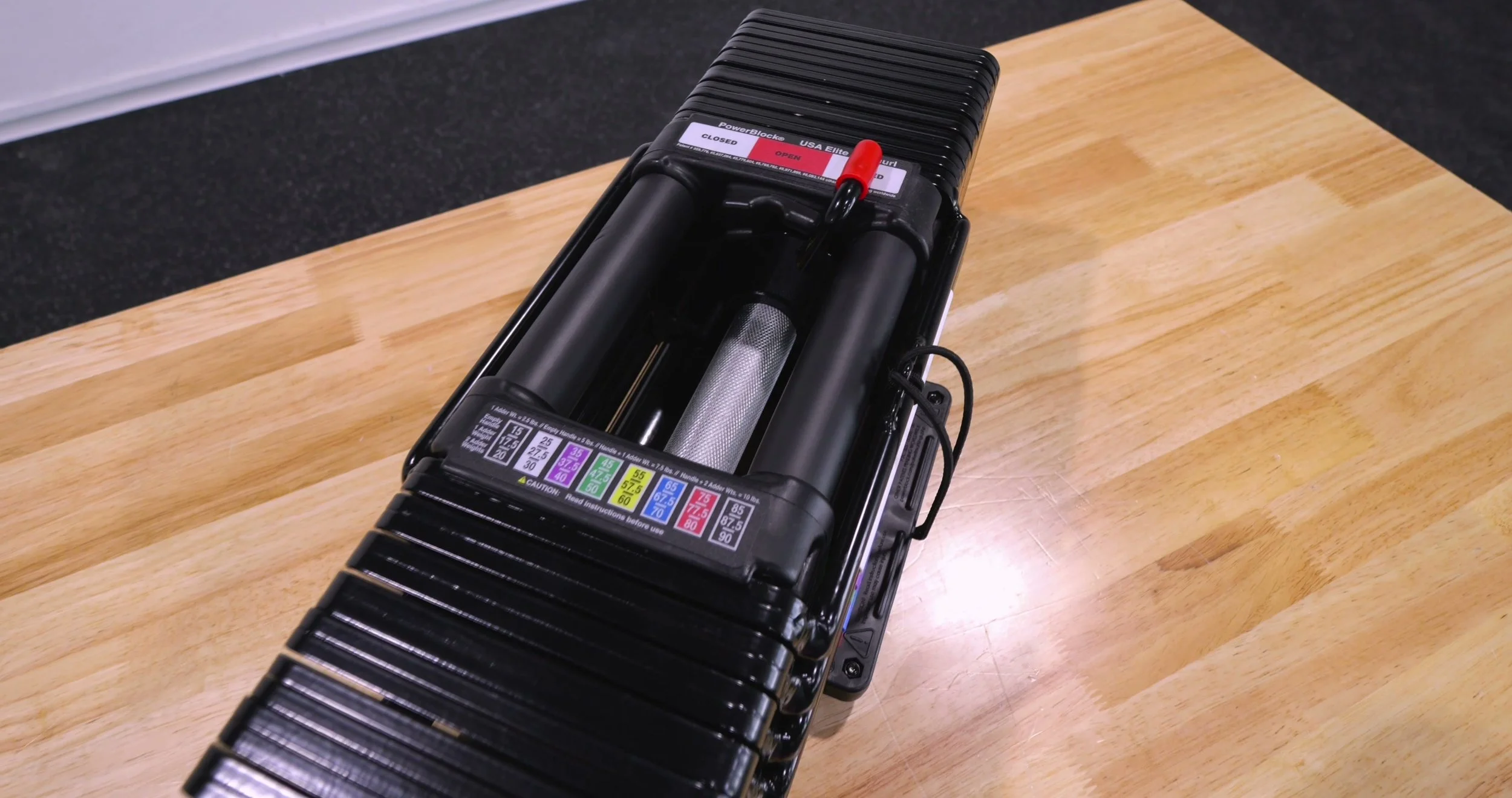 Close-up of the 32mm knurled stainless steel handle inside the PowerBlock cage