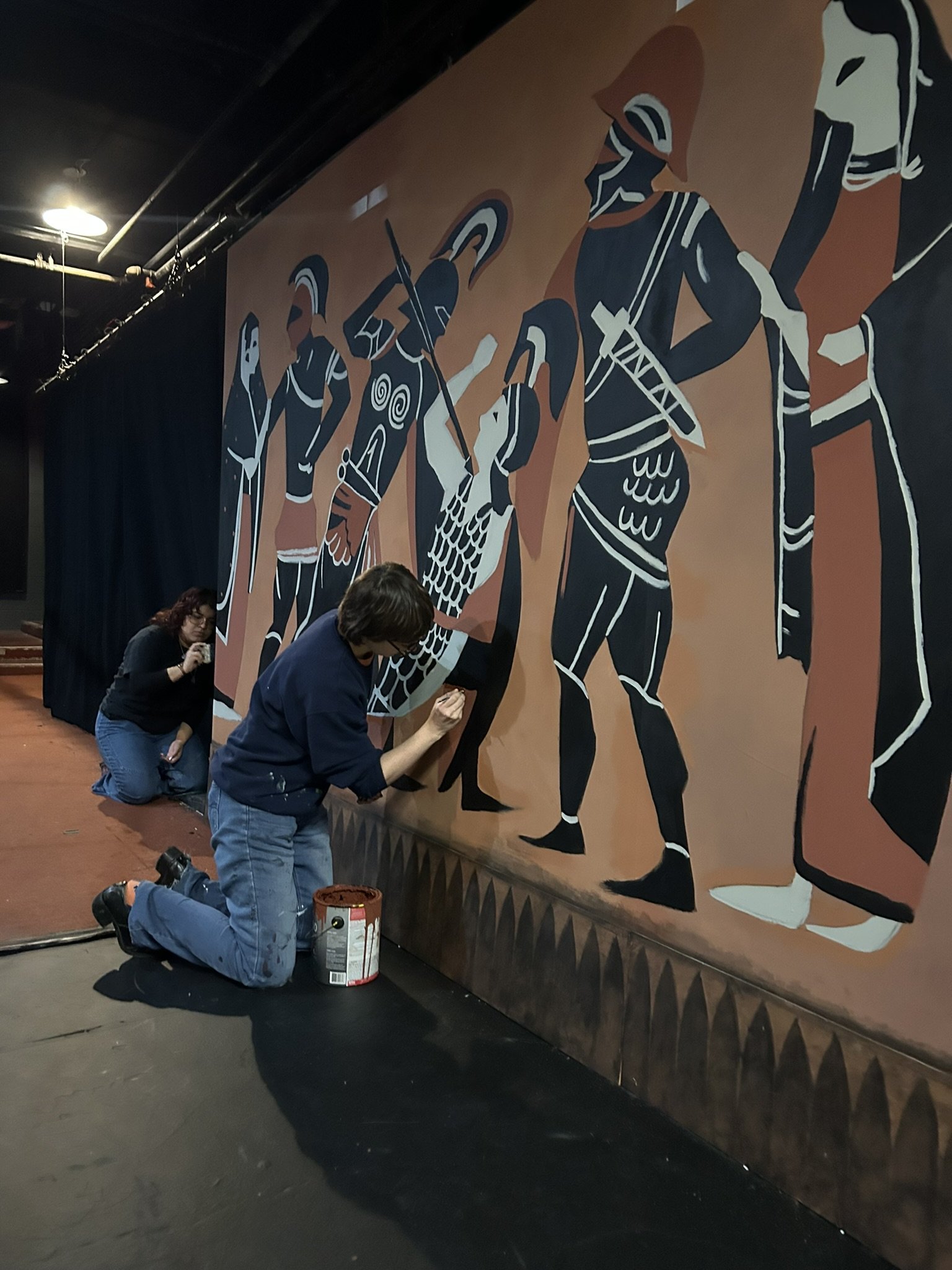 Gail adding detail to the pottery walls