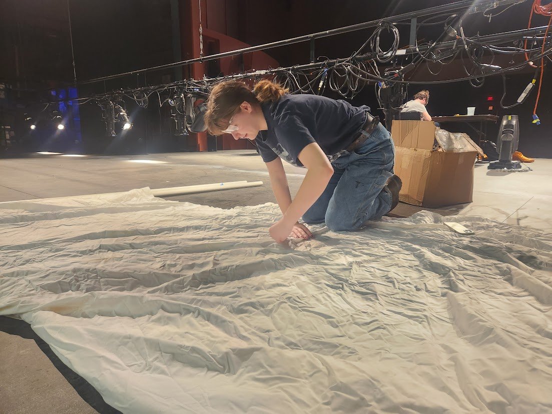 Designer Natalie working on the wings