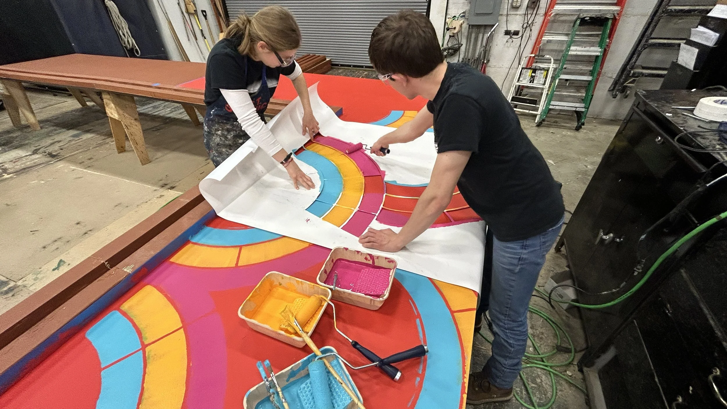 Workers using the stencil