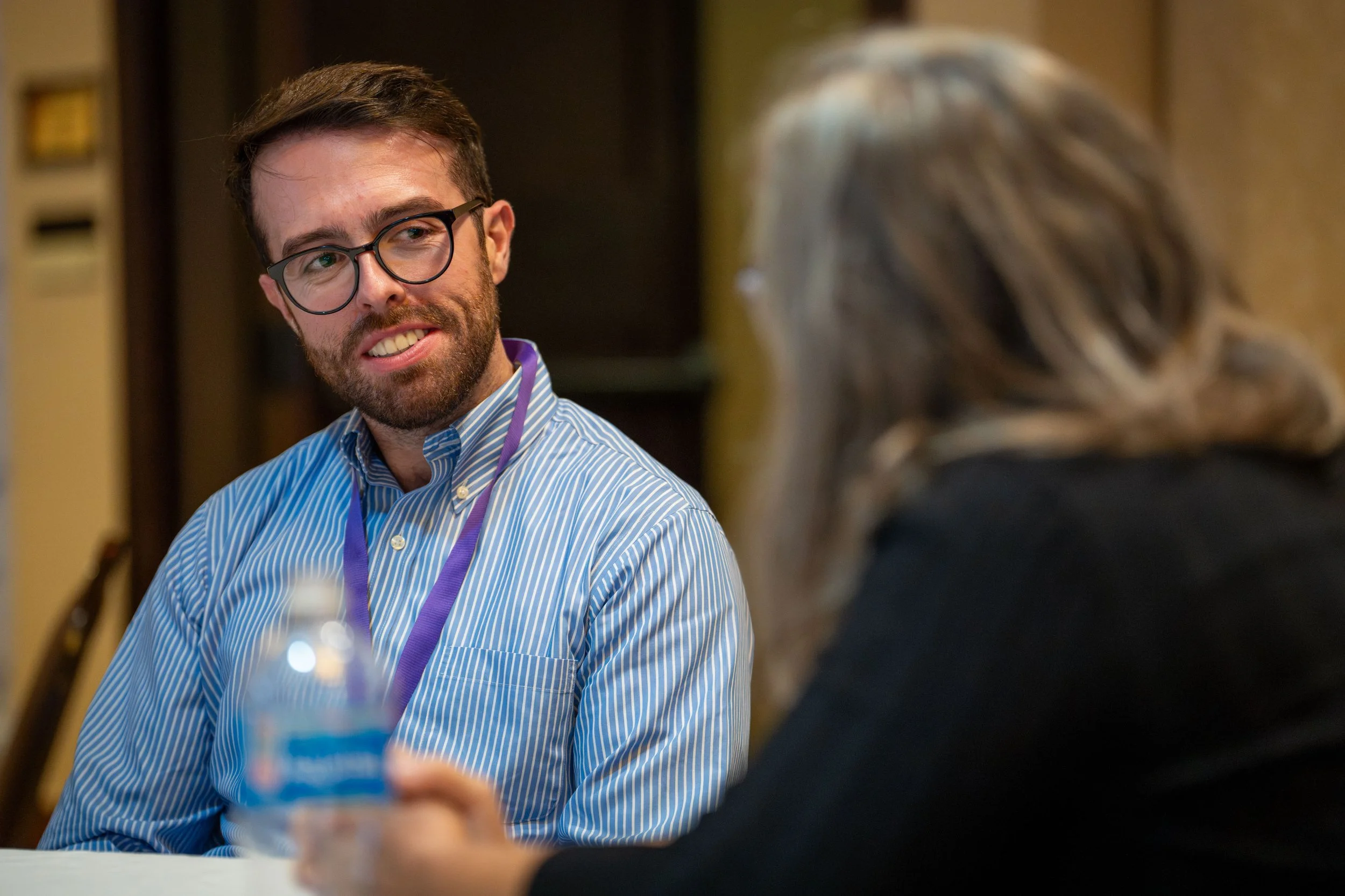 Man smiling at person