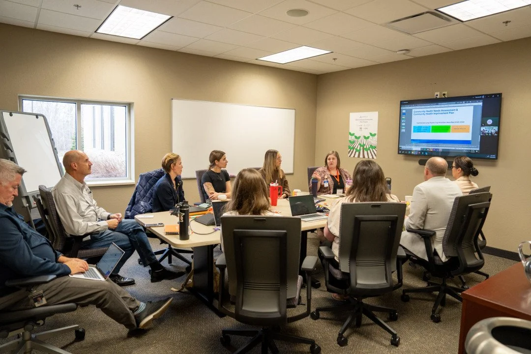 A group of people working at a table
