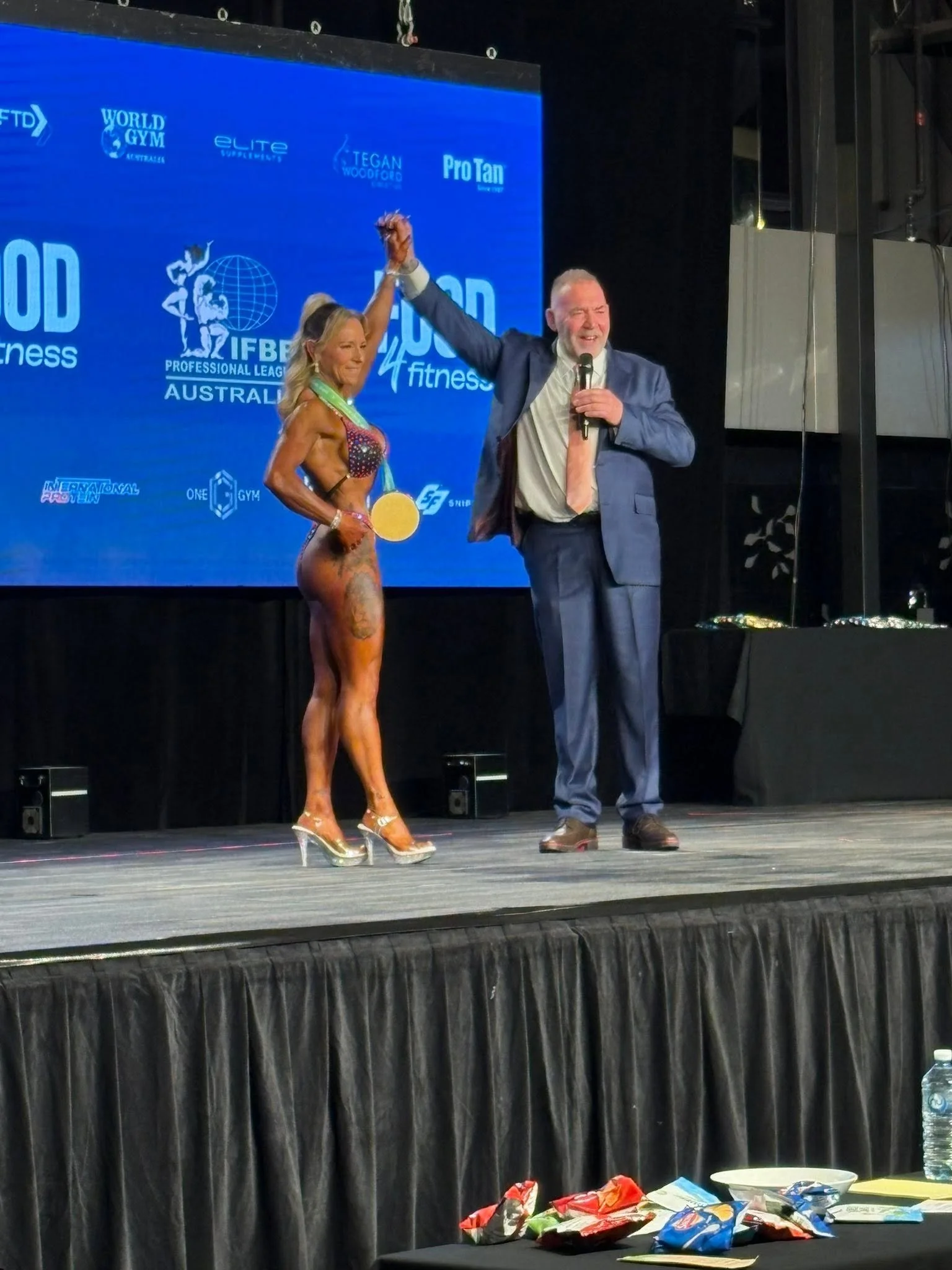 2025 IFBB Michelle winner pose.jpg