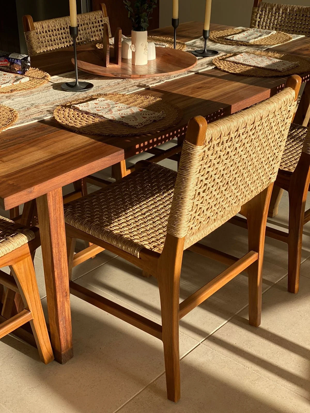 Wooden dining table with woven chairs