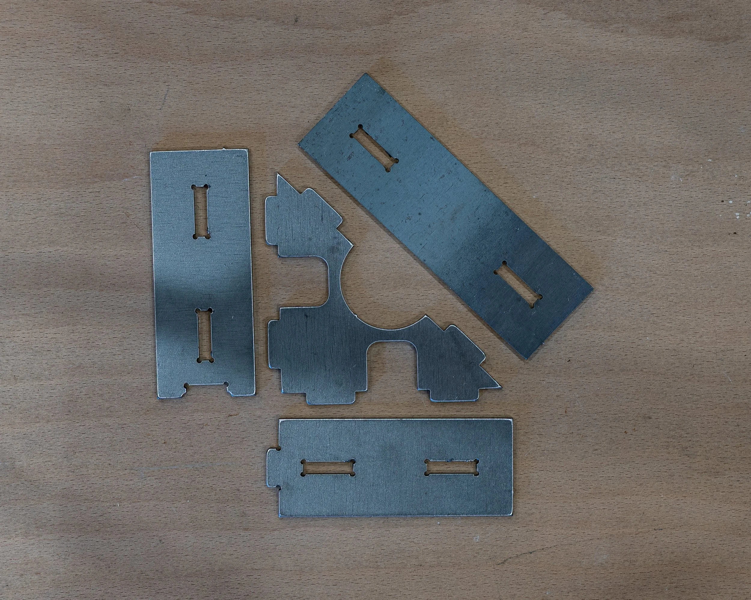 Laser-cut TDB Fab welding jigs and fabrication parts in the workshop
