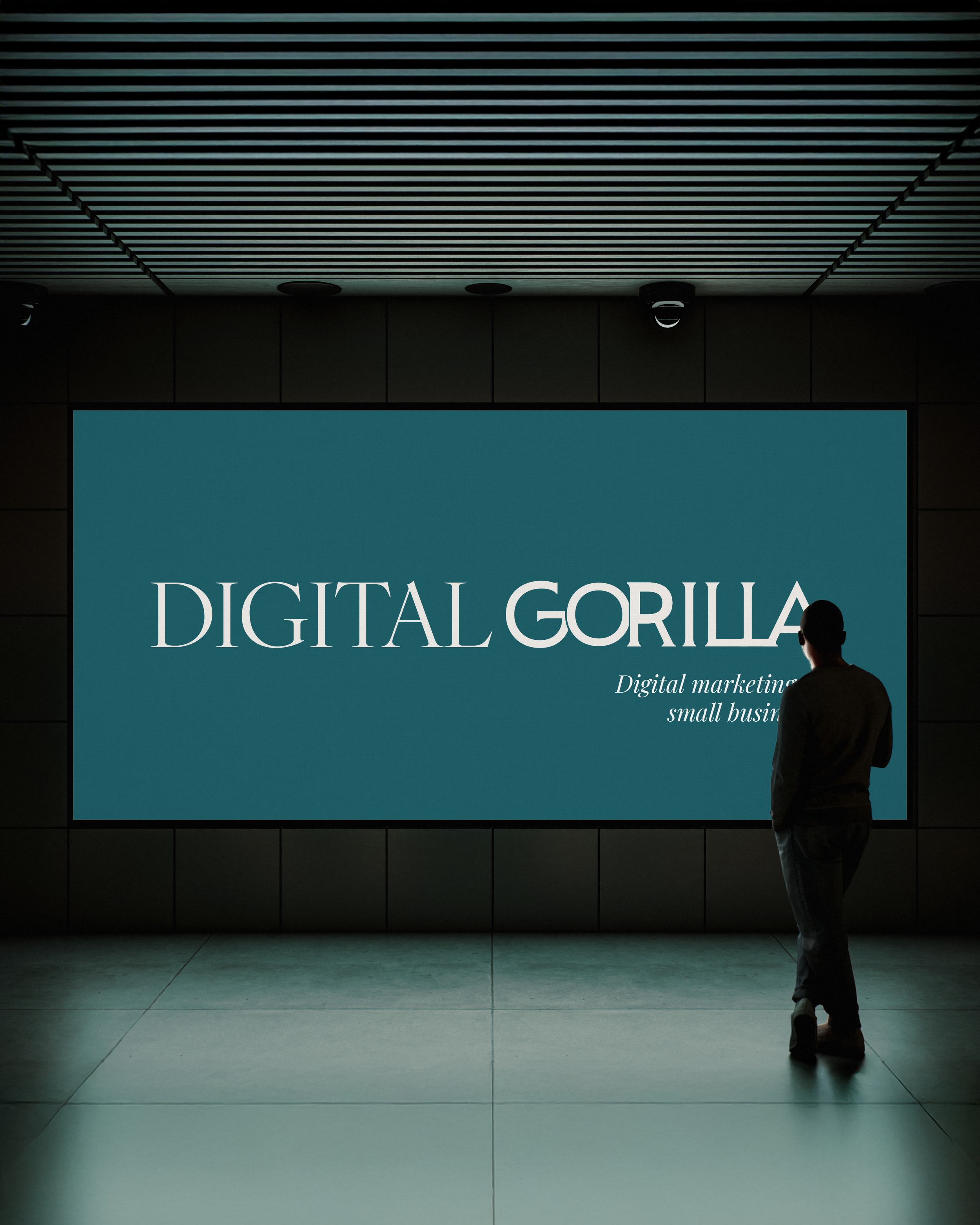 Person standing in front of a large illuminated sign reading "DIGITAL GORILLA" with smaller text "Digital marketing small business" in an indoor setting.