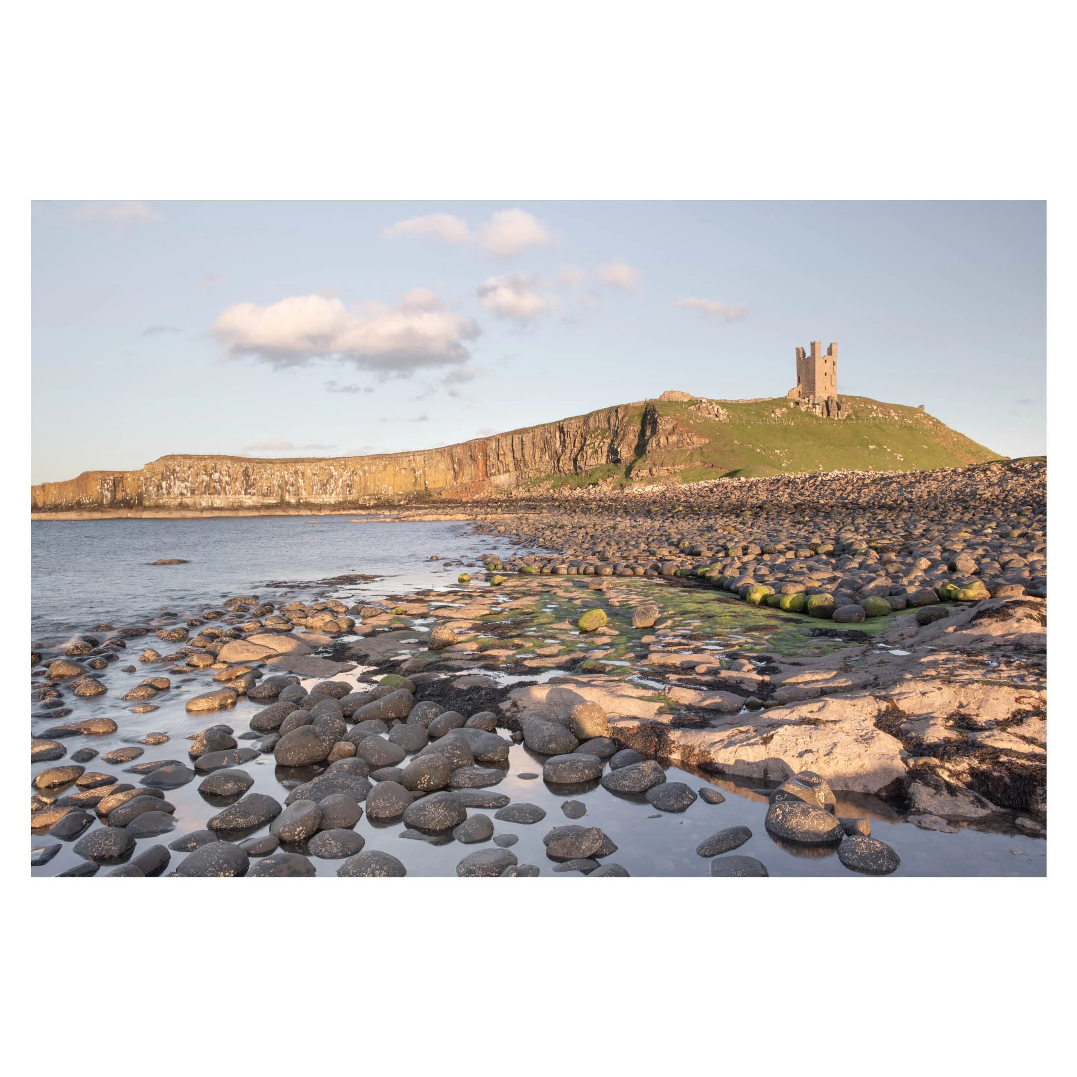 Dunstanburgh Castle at sunset, Northumberland