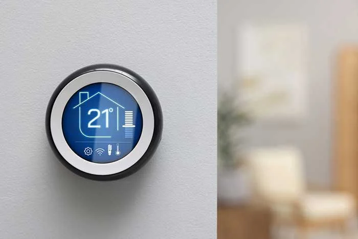 smart WIFI thermostat on the wall