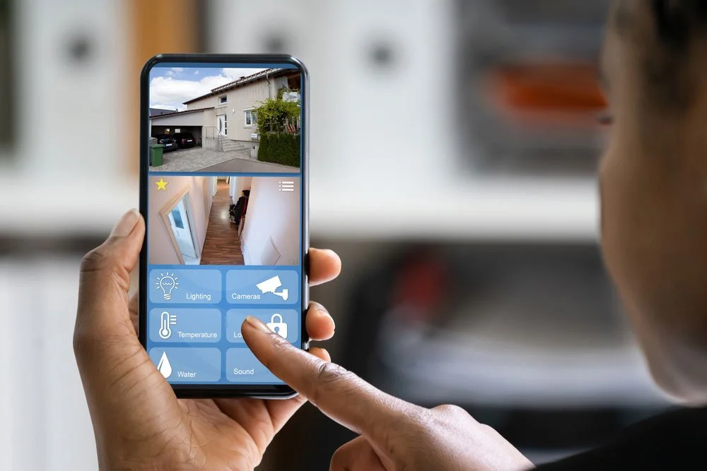 customer using their smart phone to control the smart security system