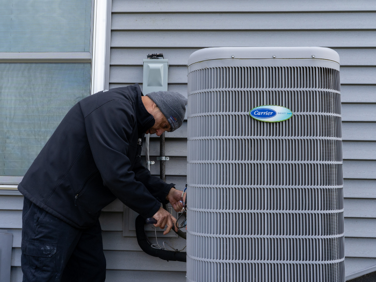 Lakeside Service Co. technician checking AC Unit