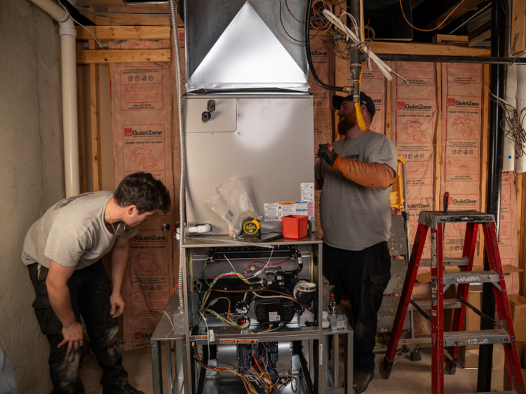 Lakeside Service Co. technician checking HVAC system