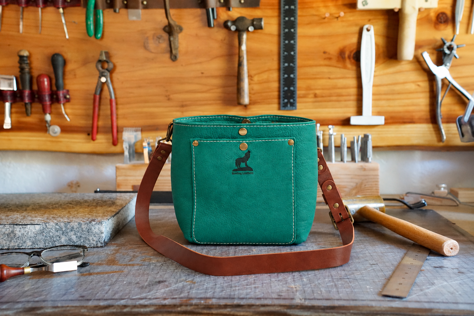 Teal Wolfpack 8 on a Leather Bench.png