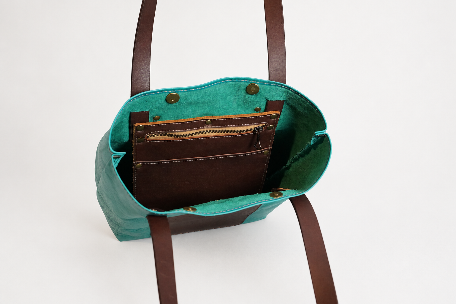 Open teal leather bag with brown organizer-4.png