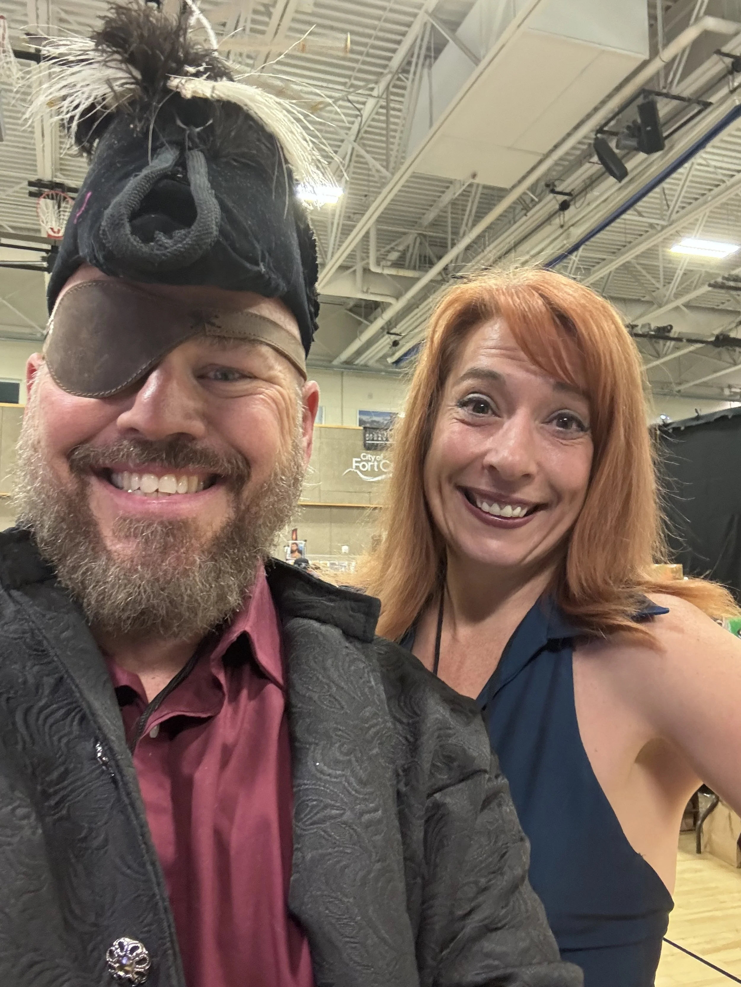 Todd Welch and Katie Strength, the creative duo behind OuterRim Creatives, photographed together during a cosplay event.