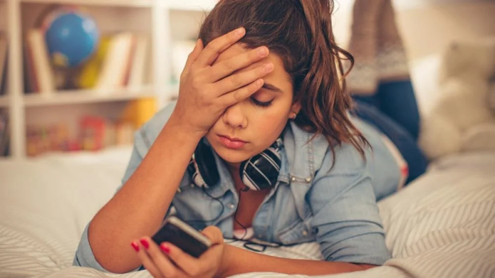 Depressed girl on phone