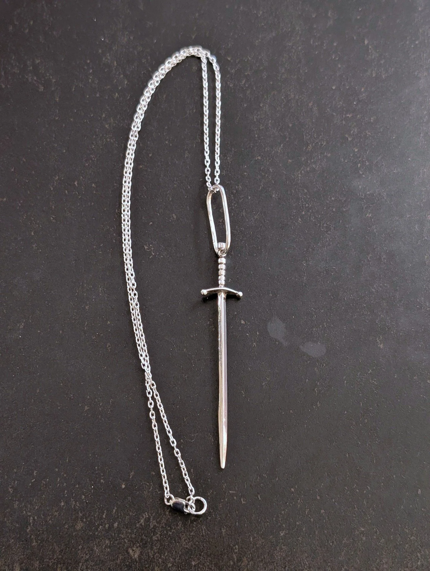 Sword necklace in silver. Designed and made by @bronson_sequels 
To see more of her work, you can drop by as usual, explore new pieces and enjoy the exhibition: What if... Jewellery meets Painting?
*
For inquiries and further details, DM or click the