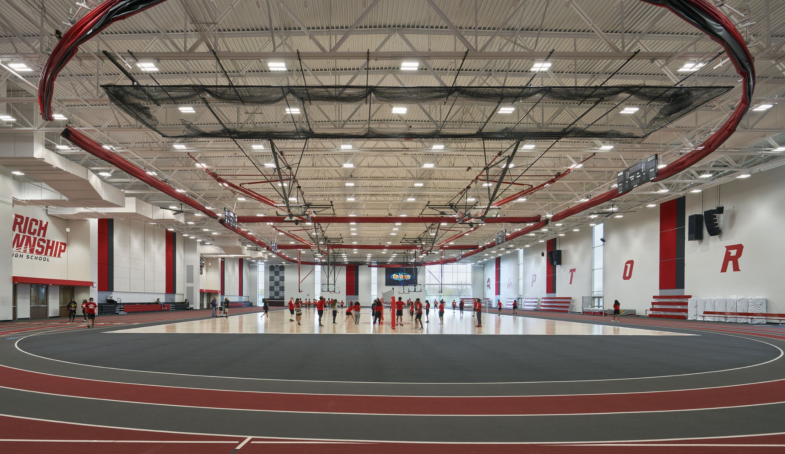 FAC comprises a new 82,127-sf field house with 200-m track and multi-sport court, lobby, concessions stand, athletic offices, weight room, ROTC room, and a separate main entrance; band and orchestra rooms; 7 science classrooms; 2 AV studios; a new cu