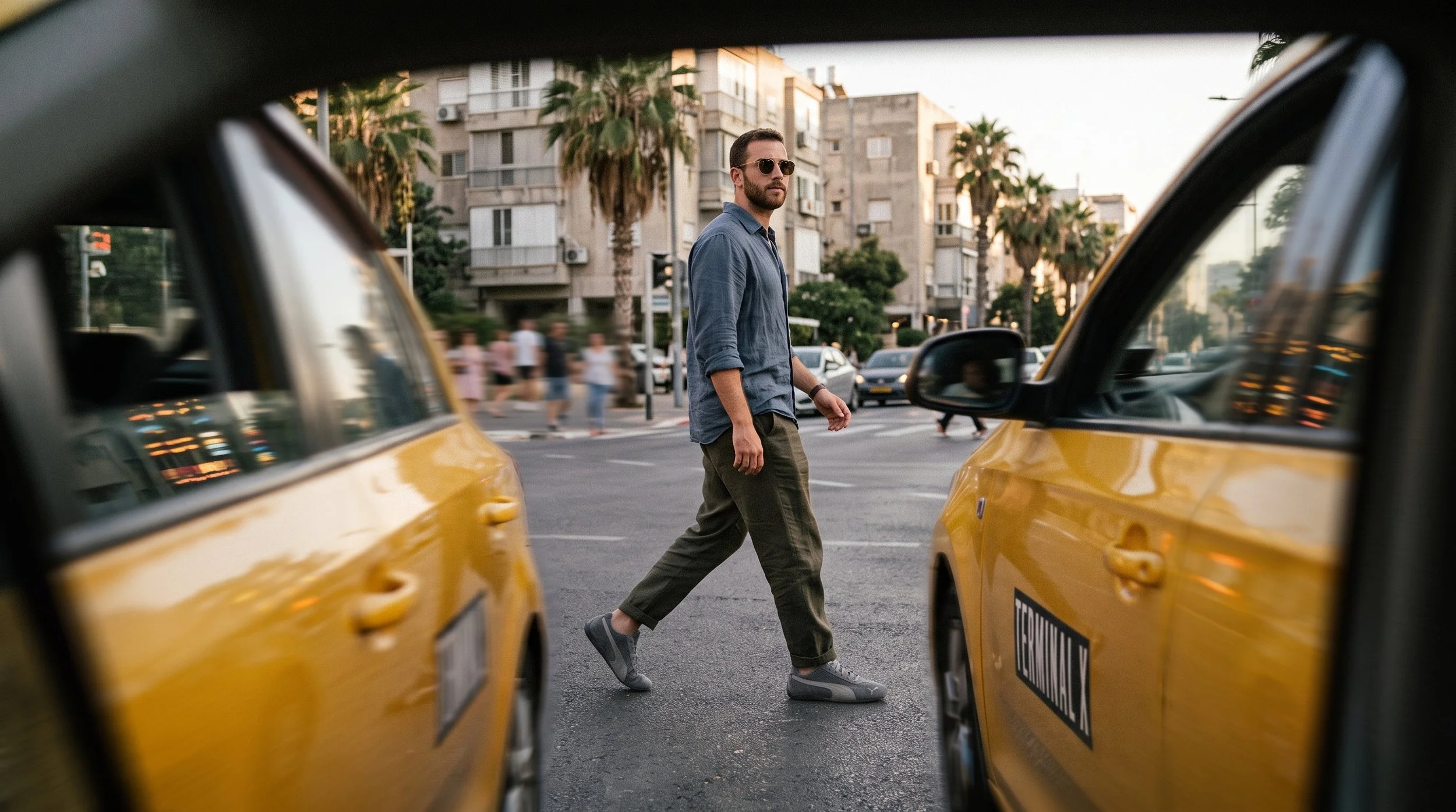 Man_crossing_street_behind_taxi_202608181118.jpeg