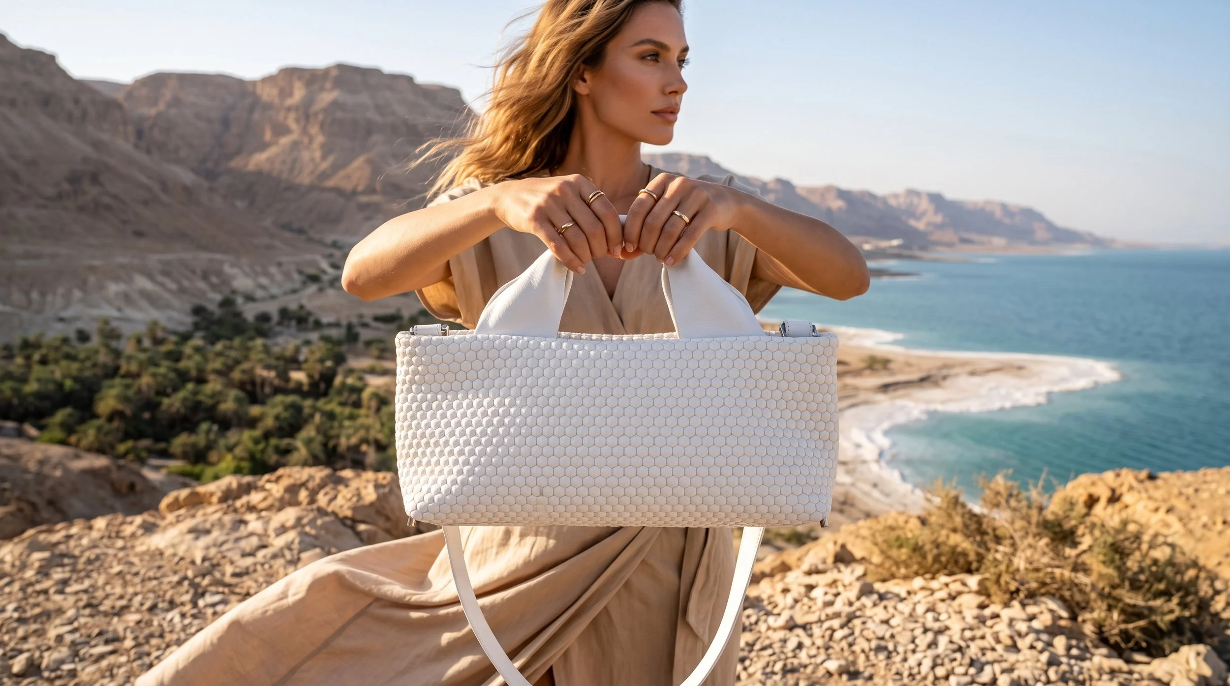 Model_holding_bag_desert_landscape_202607131643 (5).jpeg