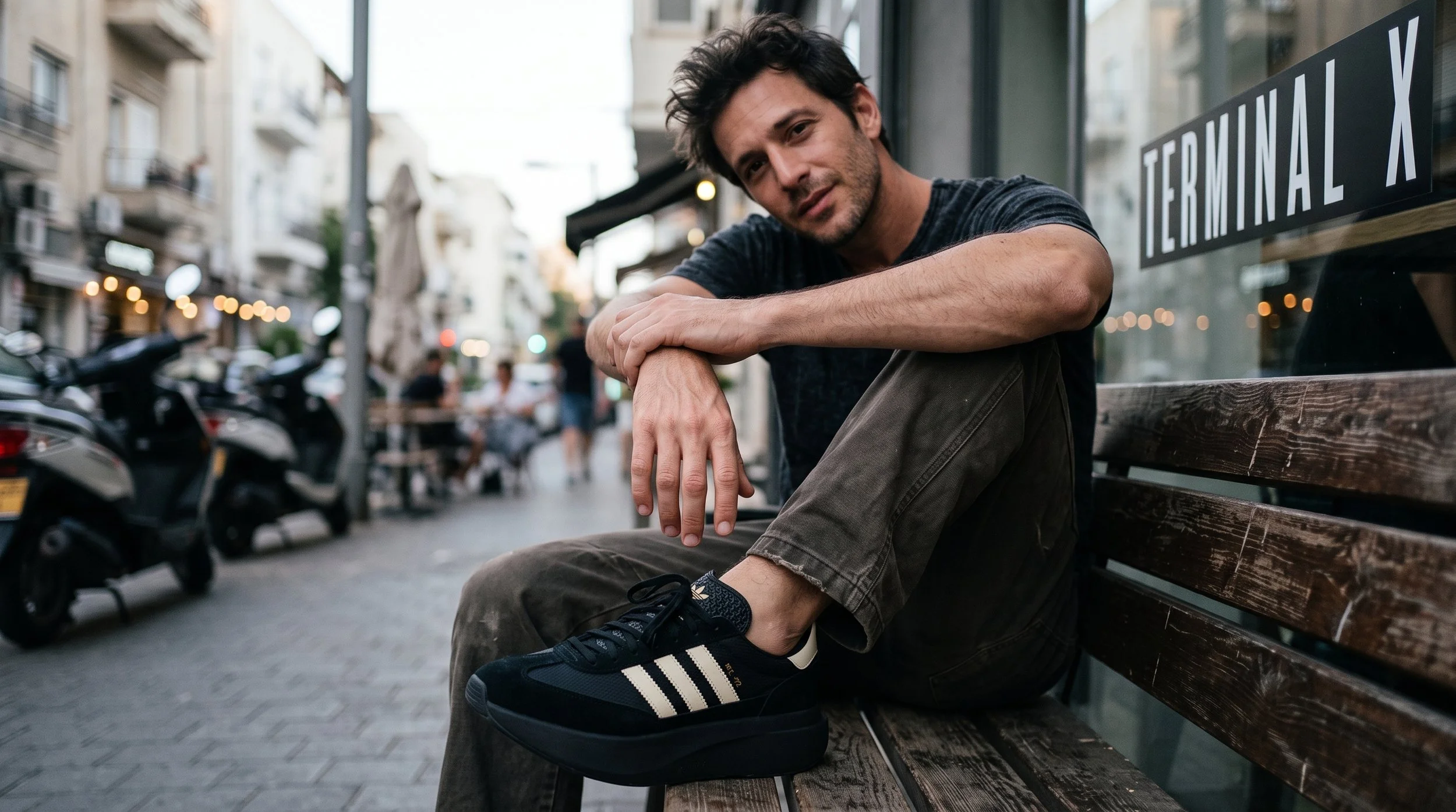 Man_sitting_on_city_bench_202608181116.jpeg