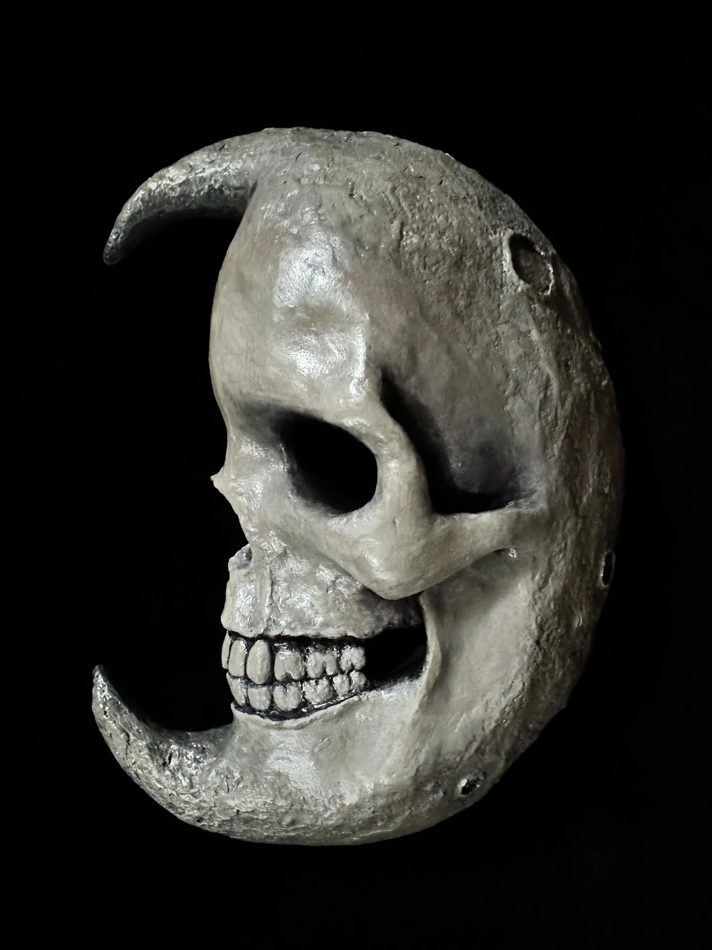 "Moonskull", Laura Nelsen, papier-mâché clay and acrylic paint, 9"x7"x2.5", 2026.