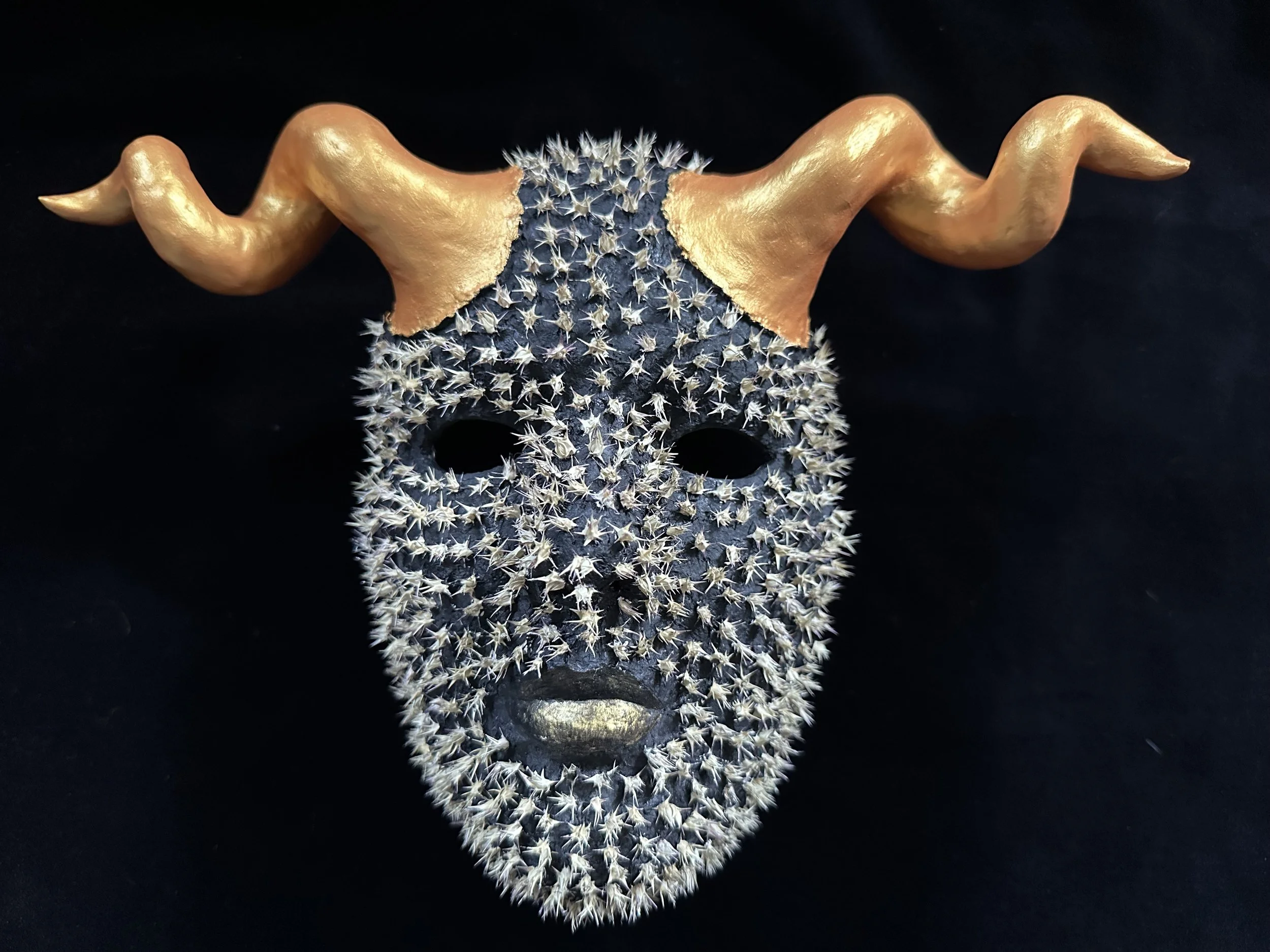 "The Protector", Laura Nelsen, papier-mâché clay, sand bur seeds and acrylic paint, 8.5"x12.5"x3.5", 2026.