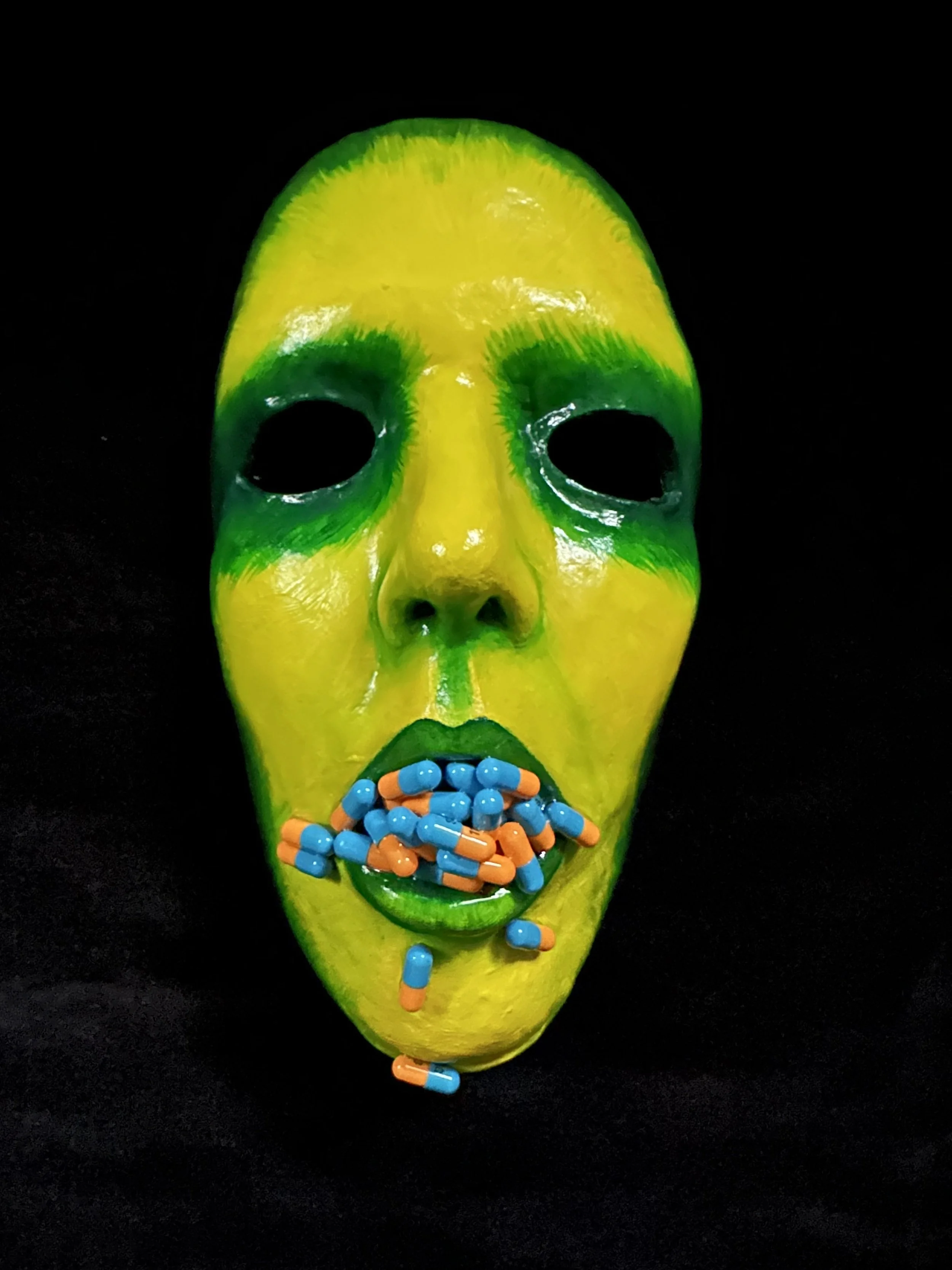 "Medicated", Laura Nelsen, papier-mâché clay, anti-depressants, acrylic paint and resin, 9"x5"x3.5", 2026. 