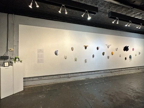 "Facing Death" Gallery view (east wall) with pedestals.