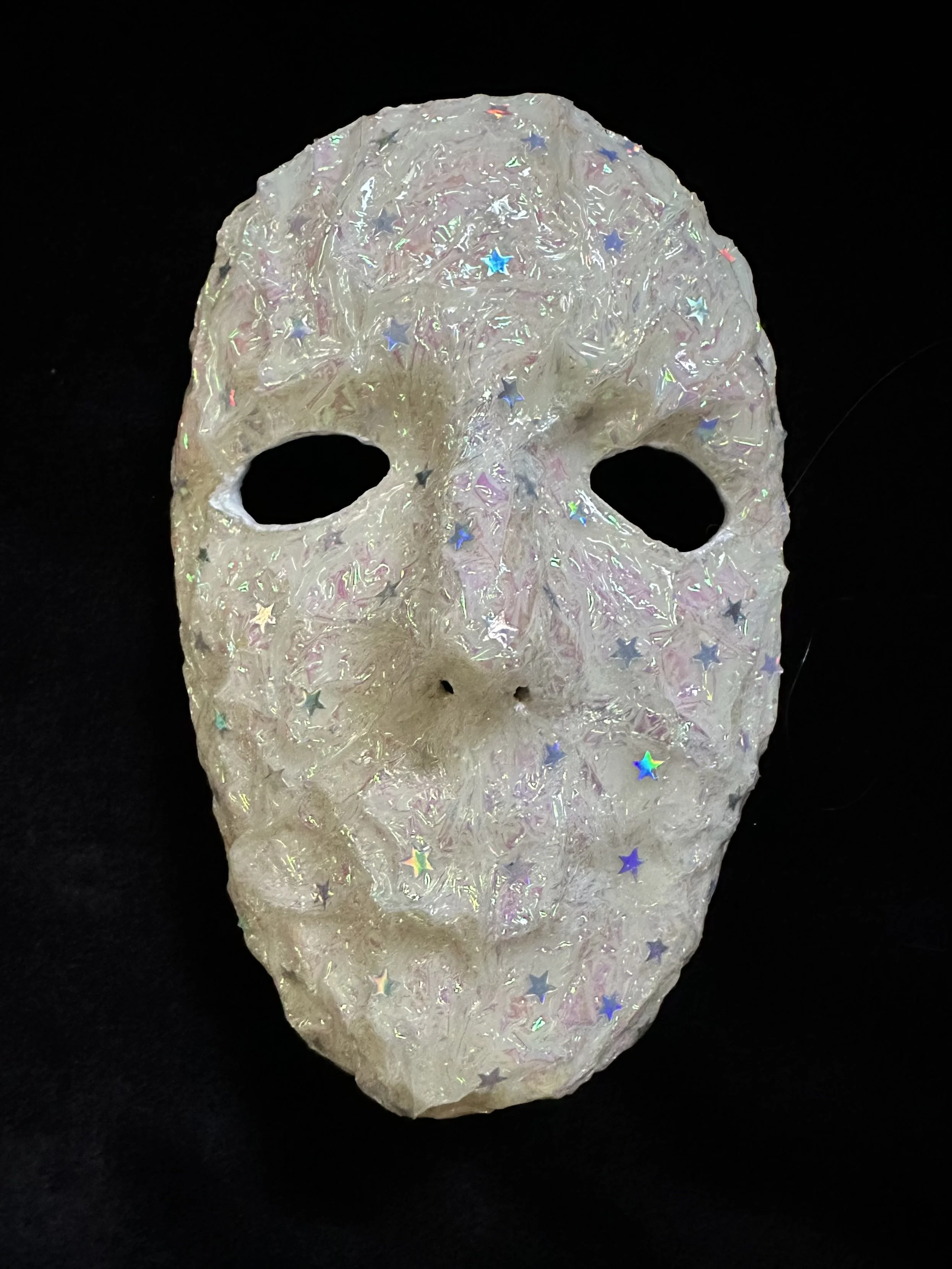 "Kairos", Laura Nelsen, papier-mâché clay, iridescent shrink film, confetti and acrylic paint, 7.25"x5"x3", 2026.