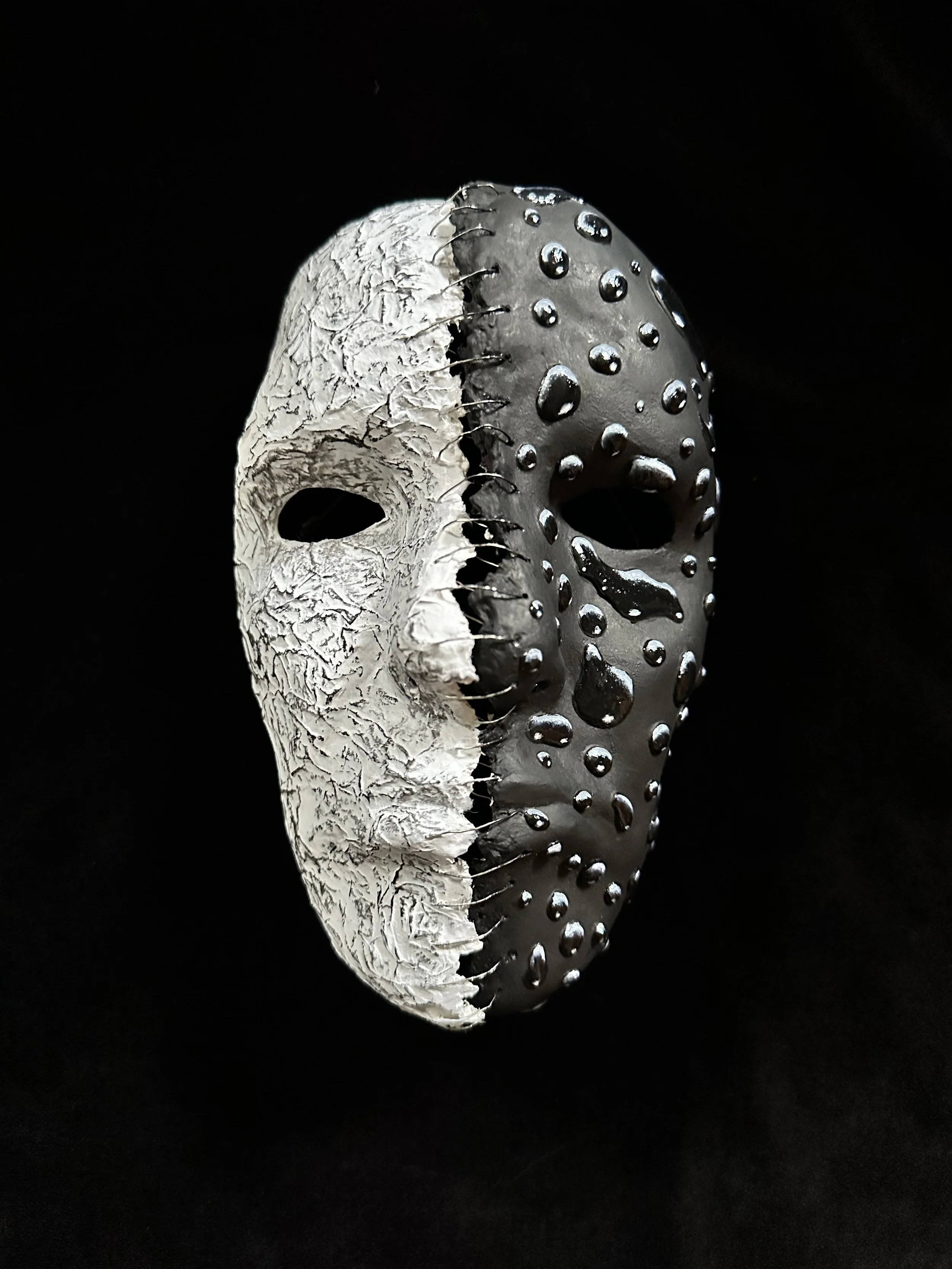 "Stitched", Laura Nelsen, papier-mâché clay, charcoal, wire, tissue paper and acrylic paint, 8"x5"3.5", 2026.