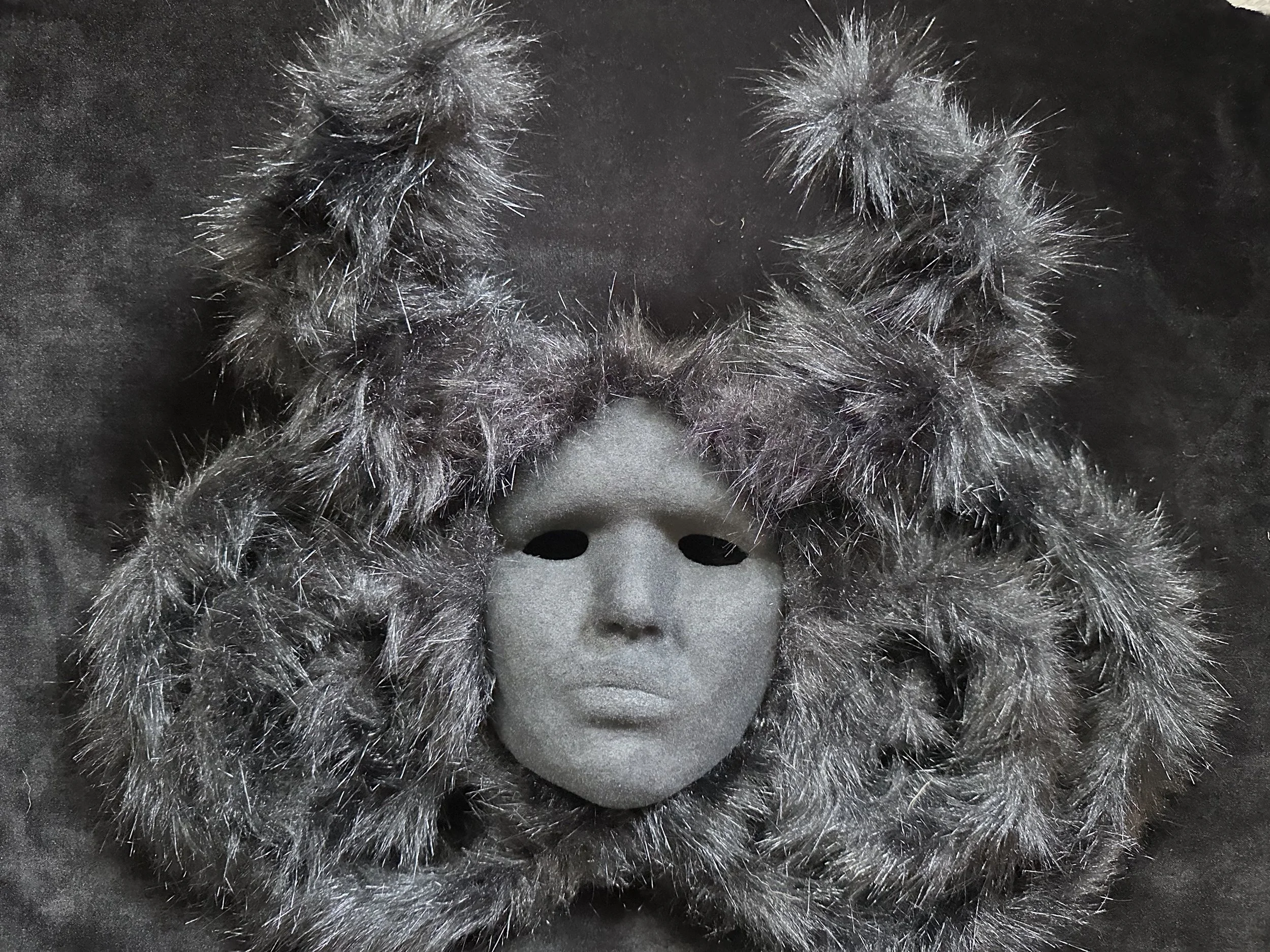 "Consumed by Darkness", Laura Nelsen, papier-mâché clay, faux fur pipe cleaners, flocking and acrylic paint, 16.5"x20"x4", 2026.