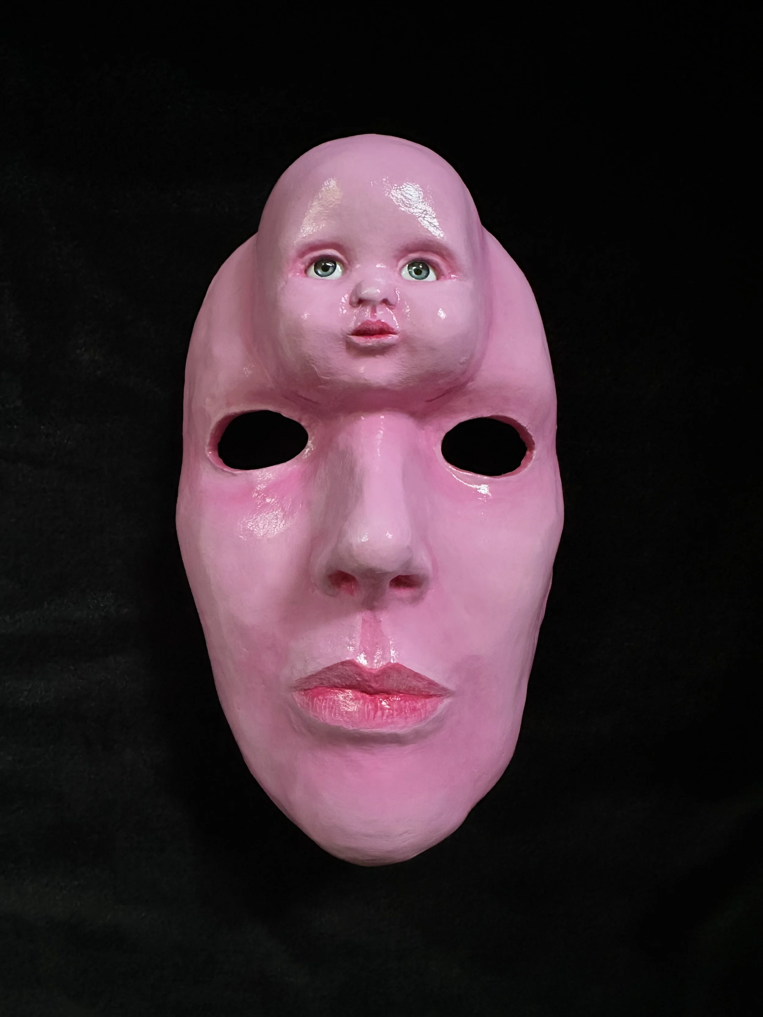 "Baby Face", Laura Nelsen, papier-mâché clay, acrylic doll eyes and acrylic paint, 8.25"x5"x3", 2026.