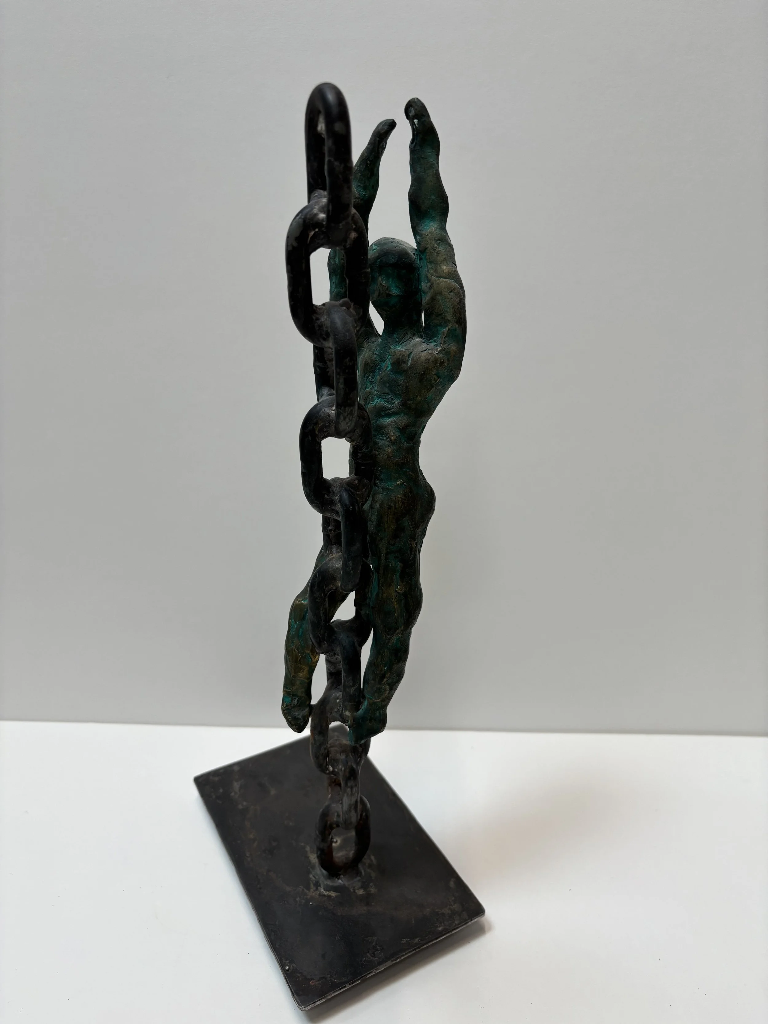 "Escape"

This third piece in the series represents the struggle to escape the weight of persecution. 