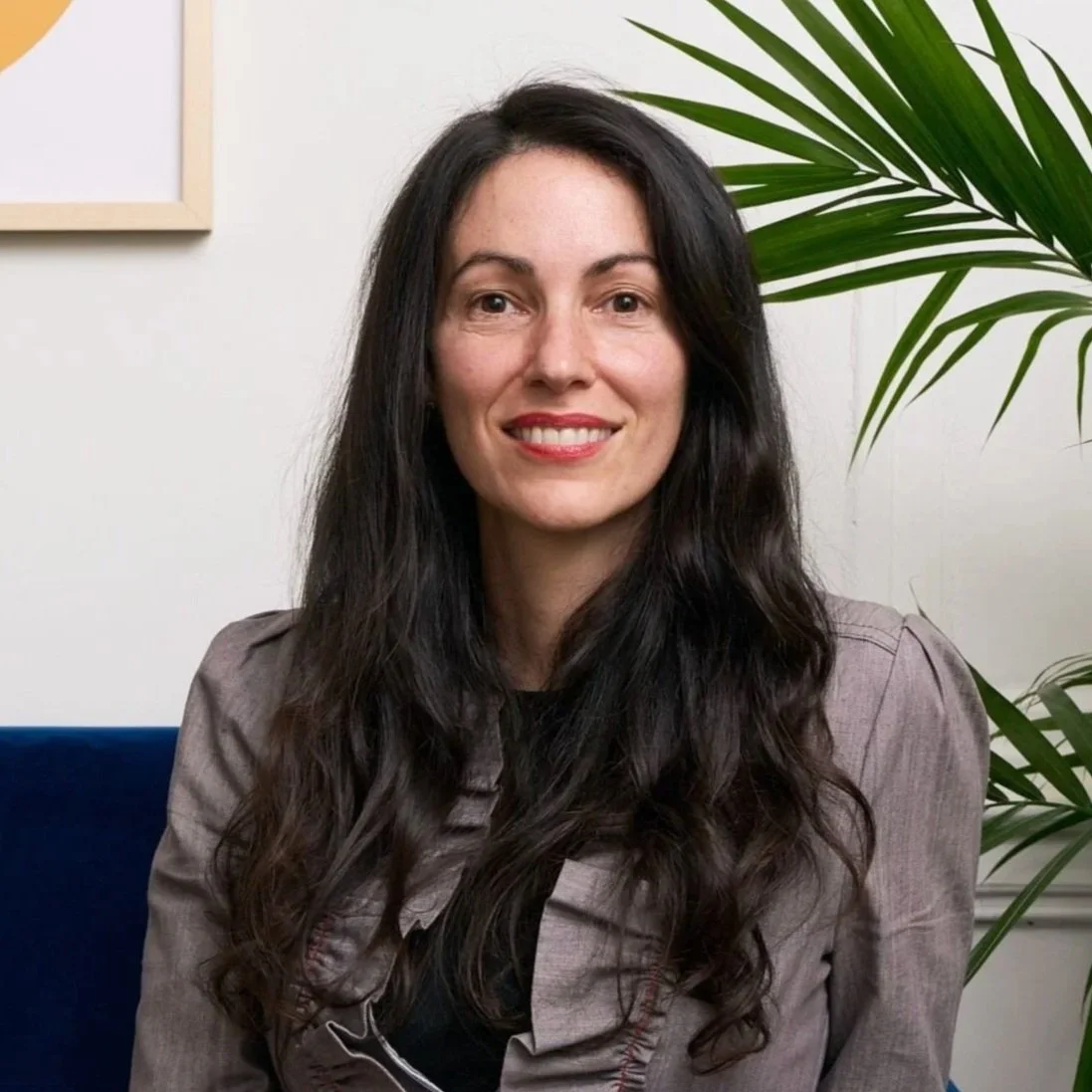 Seated in office, Psychologist Danielle Magaldi, smiling, looking at camera
