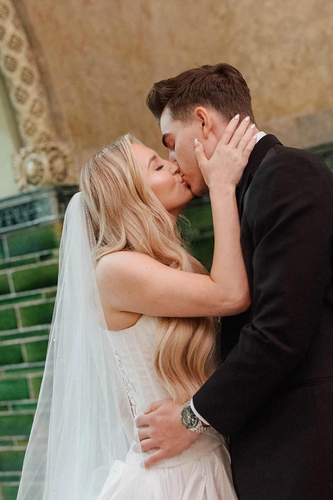 Close-up portrait of Emma and Max kissing