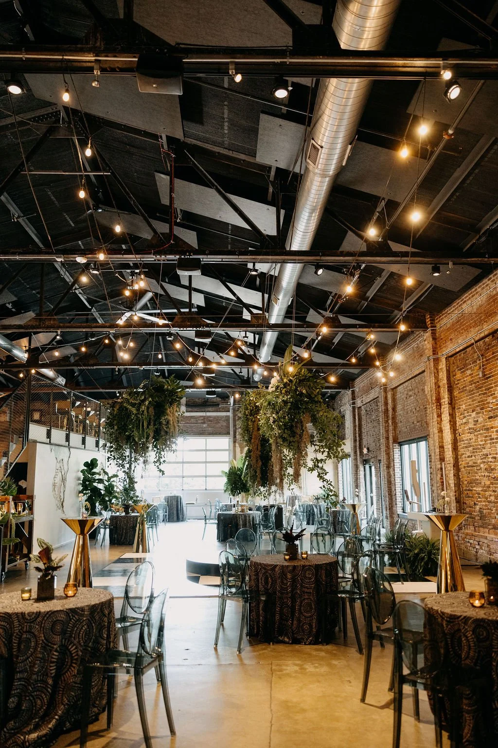 Lush greenery and string lights at Kori and Pierrick’s wedding