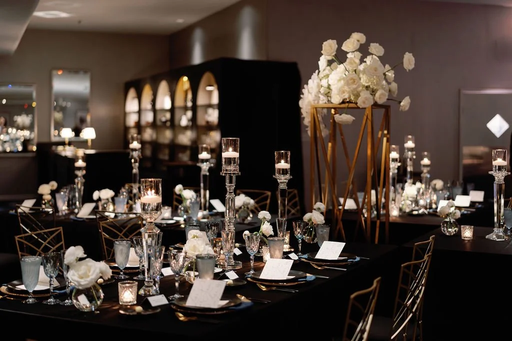 White florals and candlelit tables at Andrea and Dan’s wedding